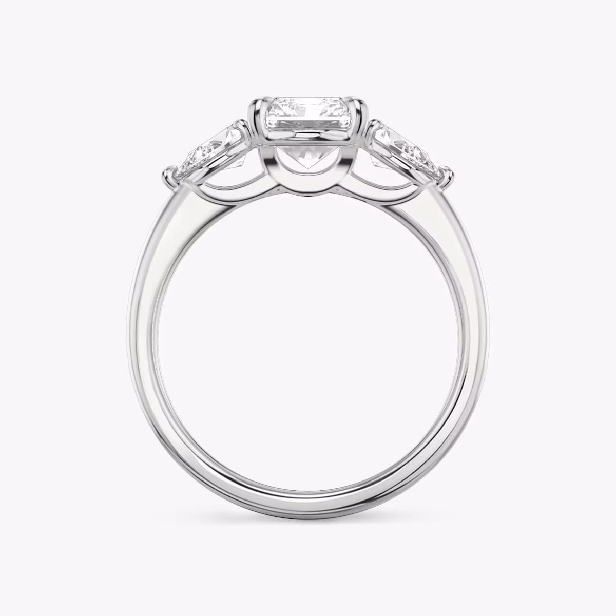 The Three Stone | Radiant | Platinum | bandAccent: Plain | sideStoneCarat: 0.25ct | sideStoneShape: Pear | diamondOrientation: vertical | caratWeight: other