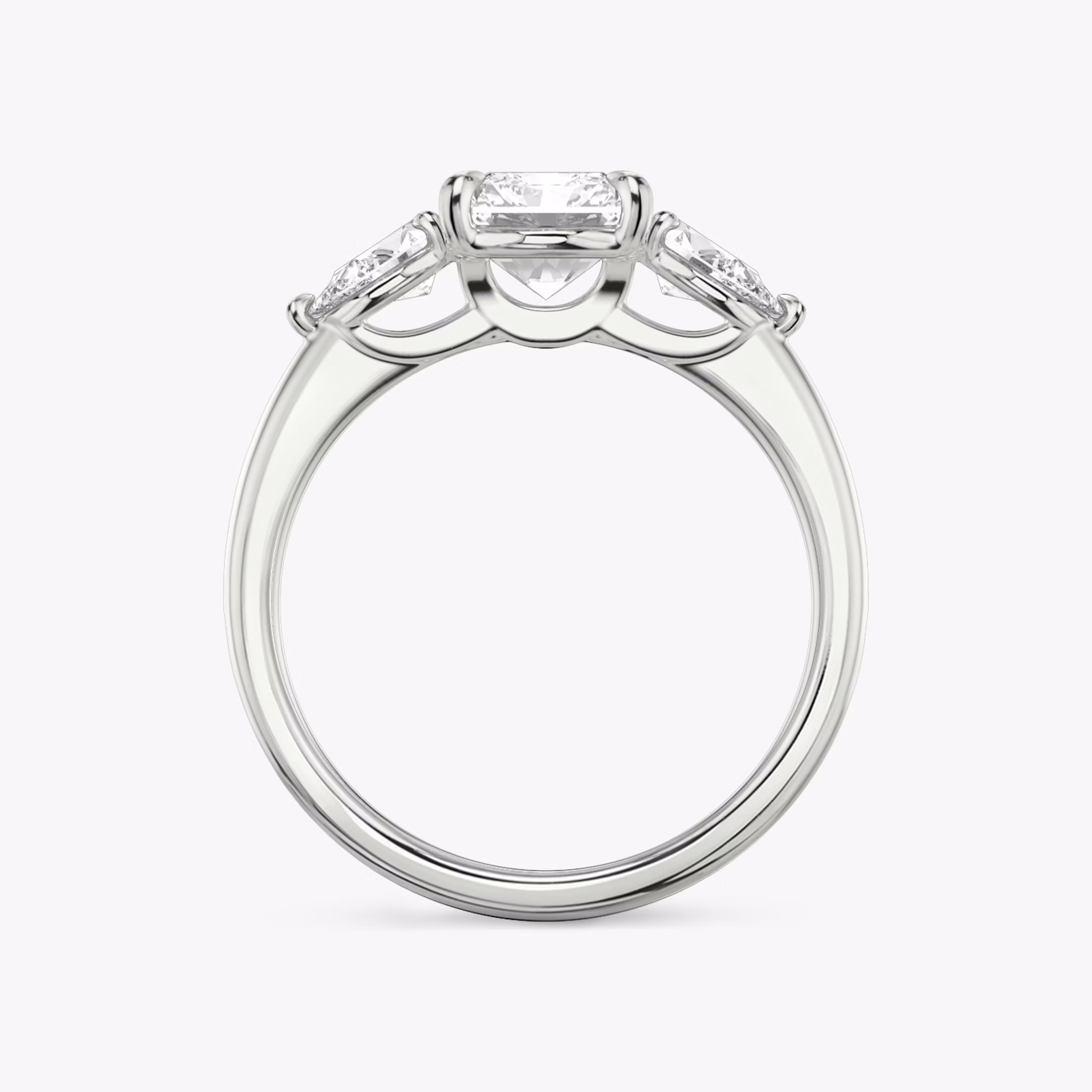 The Three Stone | Radiant | 18k | White Gold | bandAccent: Plain | sideStoneCarat: 0.25ct | sideStoneShape: Pear | diamondOrientation: vertical | caratWeight: other