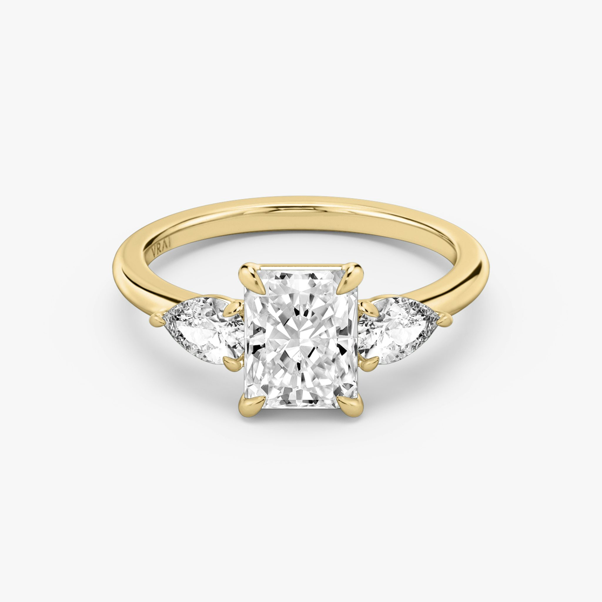 The Three Stone | Radiant | 18k | Yellow Gold | bandAccent: Plain | sideStoneCarat: 0.25ct | sideStoneShape: Pear | diamondOrientation: vertical | caratWeight: other