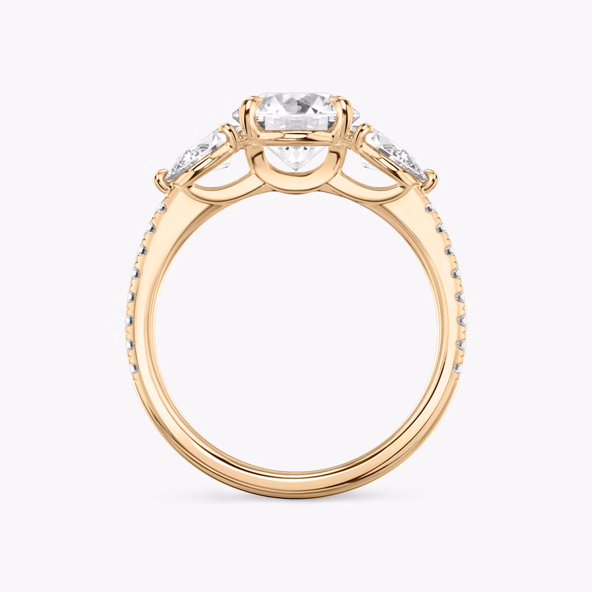 The Three Stone | Round Brilliant | 14k | Rose Gold | bandAccent: Pavé | caratWeight: other | sideStoneCarat: 0.25ct | sideStoneShape: Pear | diamondOrientation: vertical