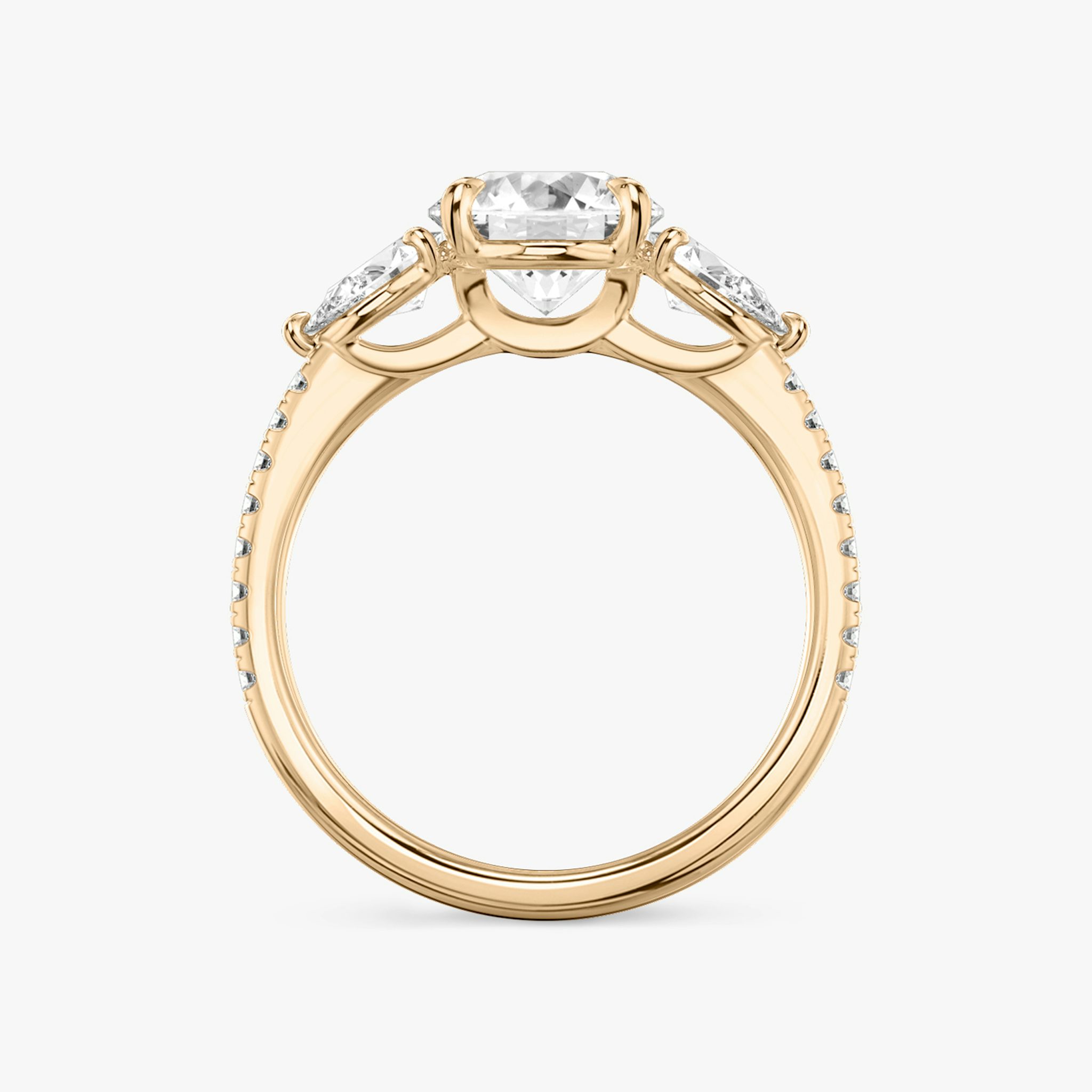 The Three Stone | Round Brilliant | 14k | Rose Gold | bandAccent: Pavé | caratWeight: other | sideStoneCarat: 0.25ct | sideStoneShape: Pear | diamondOrientation: vertical