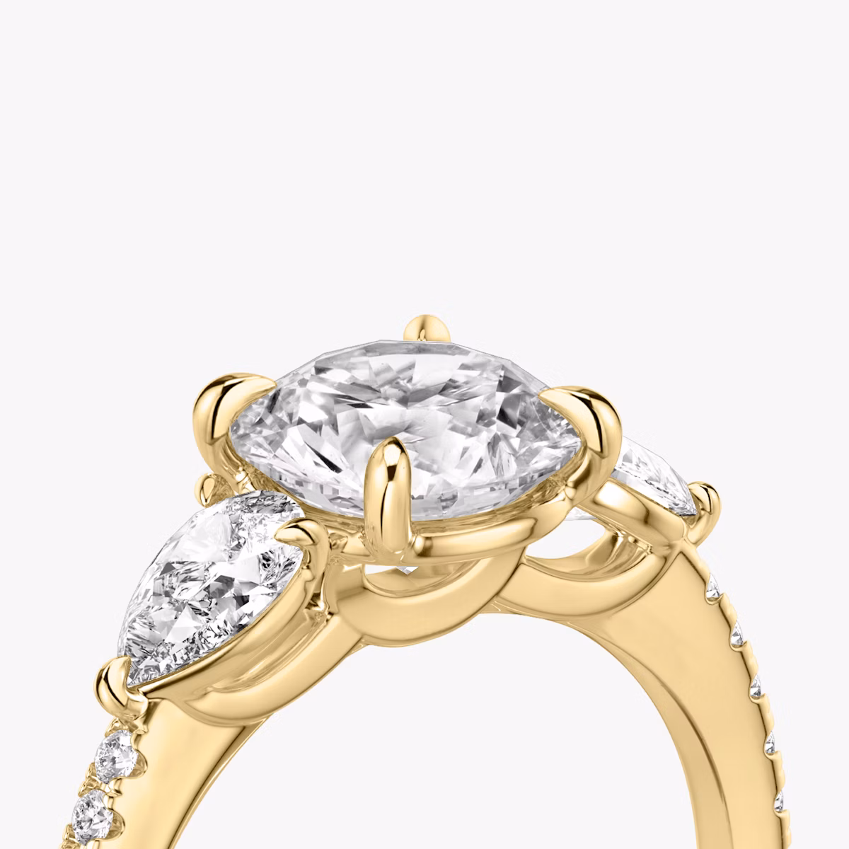 The Three Stone | Round Brilliant | 18k | Yellow Gold | bandAccent: Pavé | caratWeight: other | sideStoneCarat: 0.25ct | sideStoneShape: Pear | diamondOrientation: vertical