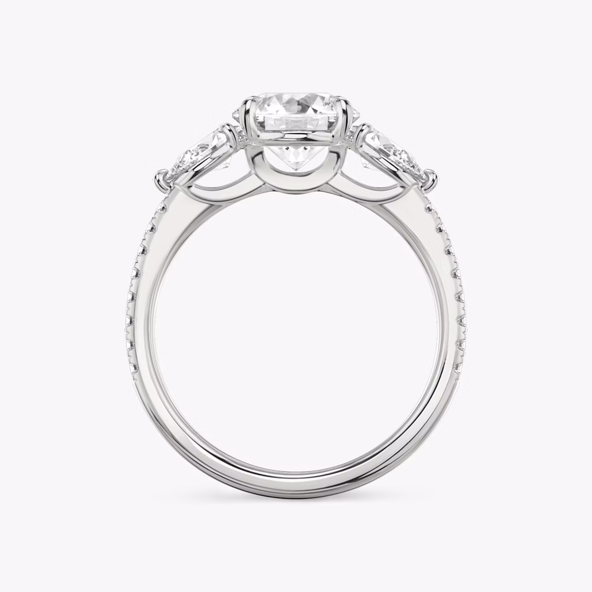 The Three Stone | Round Brilliant | 18k | White Gold | bandAccent: Pavé | caratWeight: other | sideStoneCarat: 0.25ct | sideStoneShape: Pear | diamondOrientation: vertical