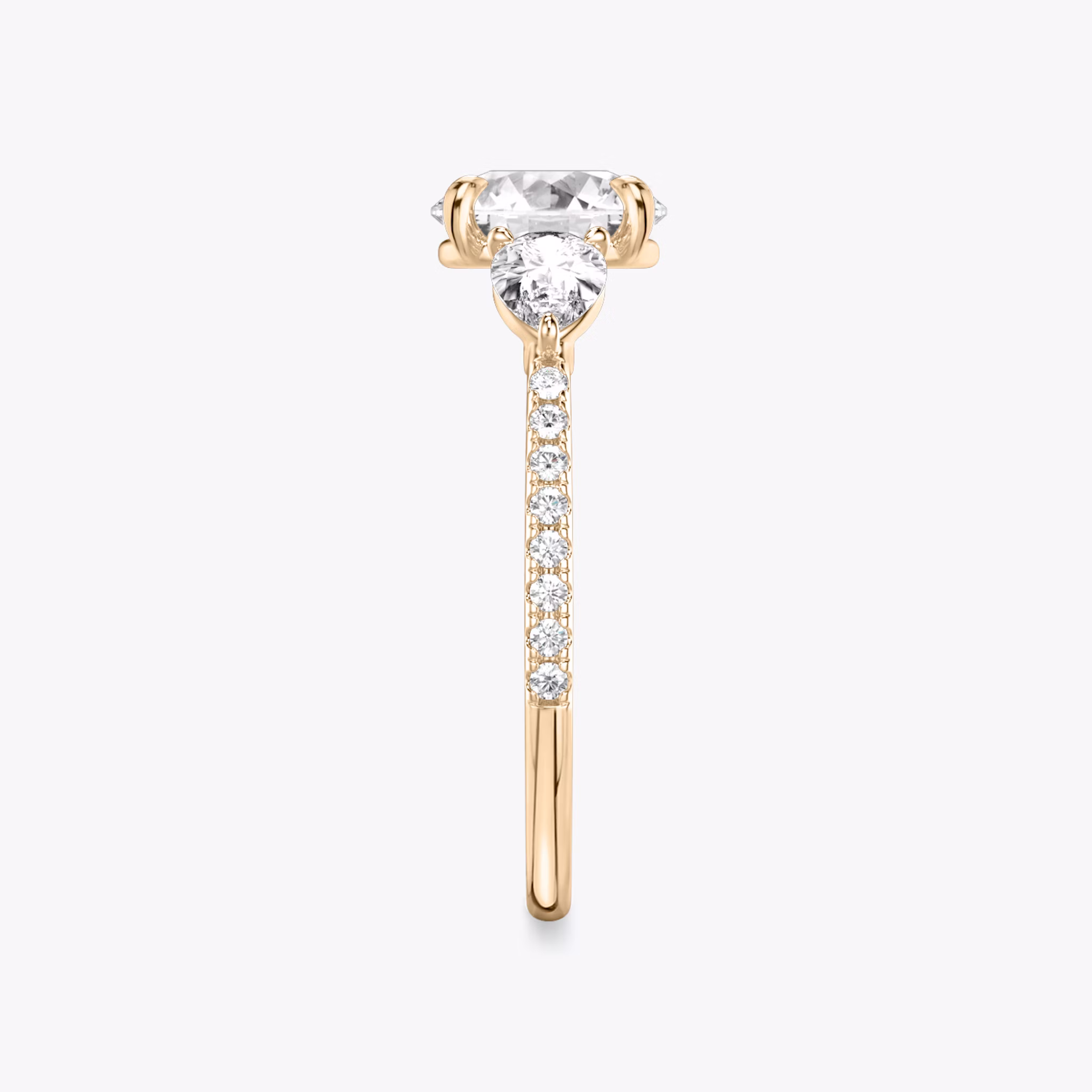 The Three Stone | Round Brilliant | 14k | Rose Gold | bandAccent: Pavé | caratWeight: other | sideStoneCarat: 0.25ct | sideStoneShape: Pear | diamondOrientation: vertical