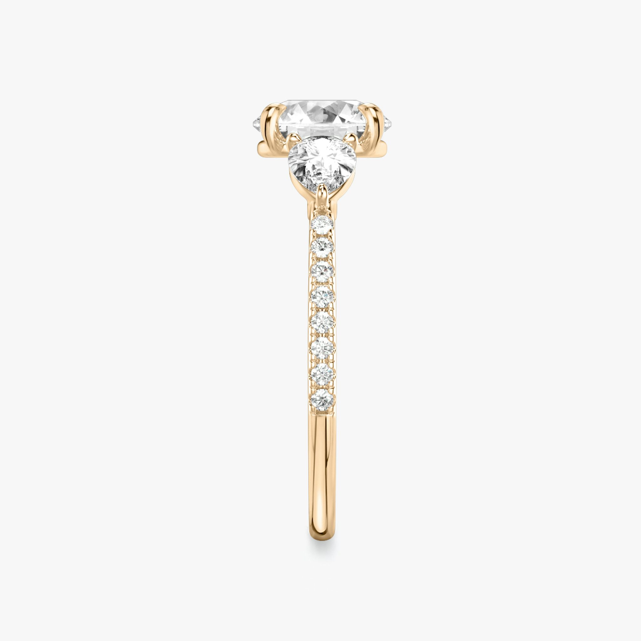 The Three Stone | Round Brilliant | 14k | Rose Gold | bandAccent: Pavé | caratWeight: other | sideStoneCarat: 0.25ct | sideStoneShape: Pear | diamondOrientation: vertical