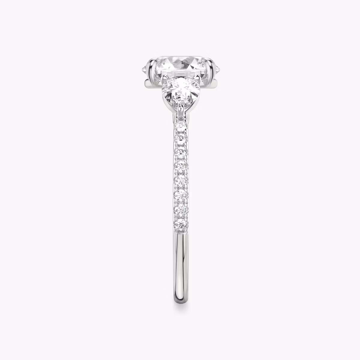 The Three Stone | Round Brilliant | 18k | White Gold | bandAccent: Pavé | caratWeight: other | sideStoneCarat: 0.25ct | sideStoneShape: Pear | diamondOrientation: vertical