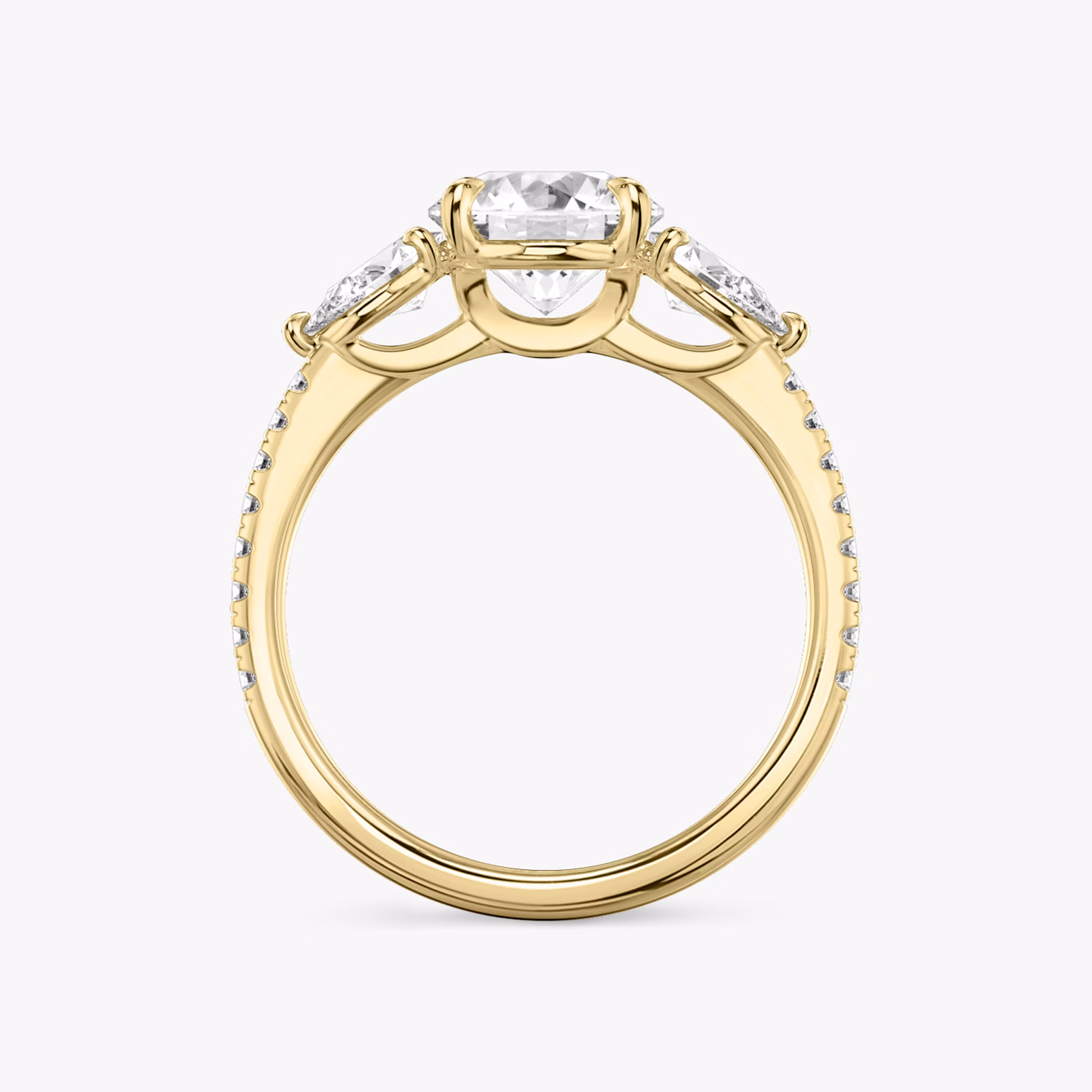 The Three Stone | Round Brilliant | 18k | Yellow Gold | bandAccent: Pavé | caratWeight: other | sideStoneCarat: 0.25ct | sideStoneShape: Pear | diamondOrientation: vertical