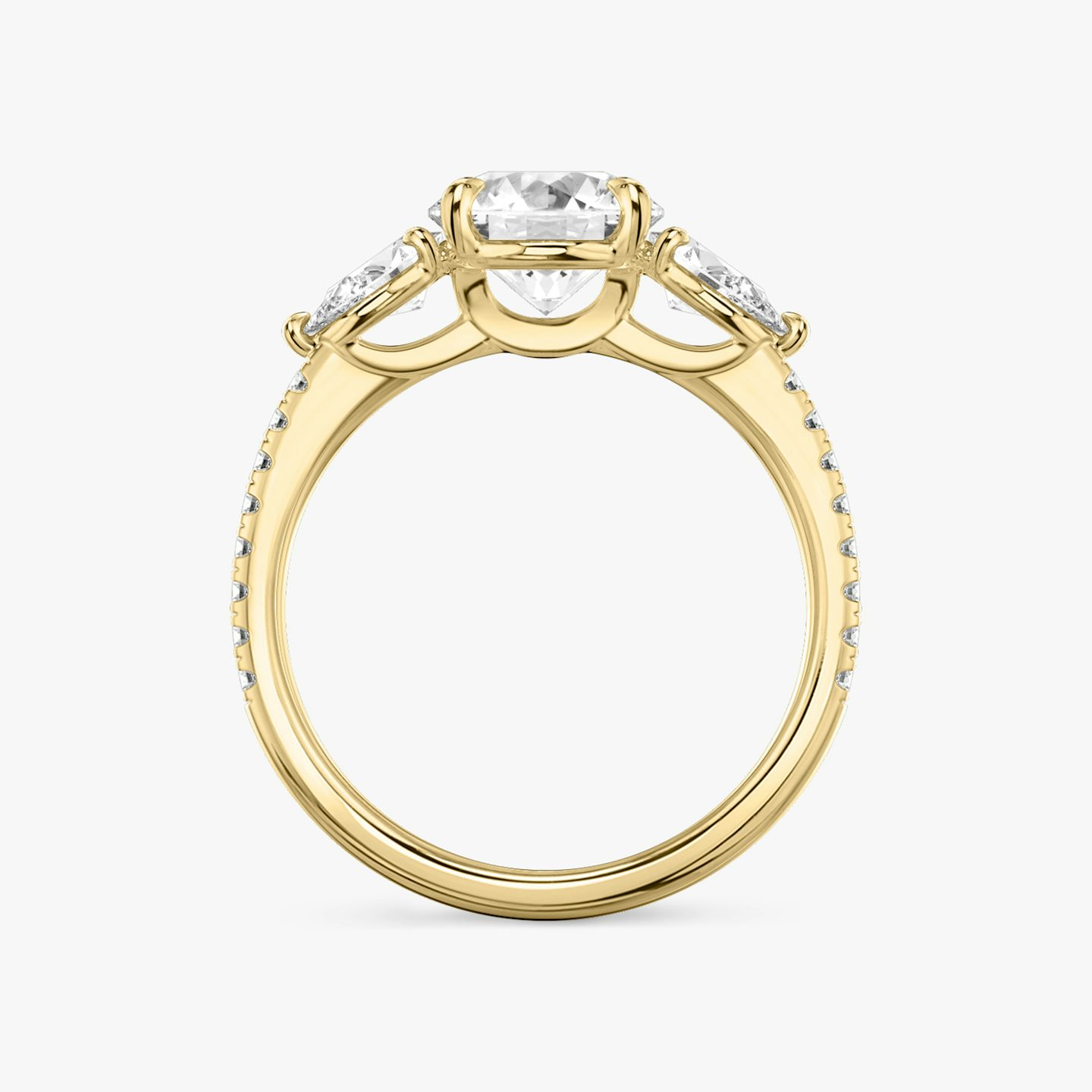 The Three Stone | Round Brilliant | 18k | Yellow Gold | bandAccent: Pavé | caratWeight: other | sideStoneCarat: 0.25ct | sideStoneShape: Pear | diamondOrientation: vertical