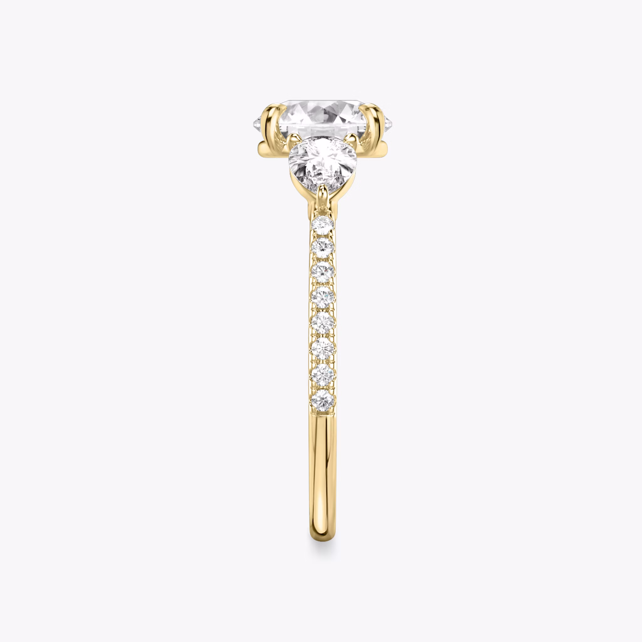 The Three Stone | Round Brilliant | 18k | Yellow Gold | bandAccent: Pavé | caratWeight: other | sideStoneCarat: 0.25ct | sideStoneShape: Pear | diamondOrientation: vertical