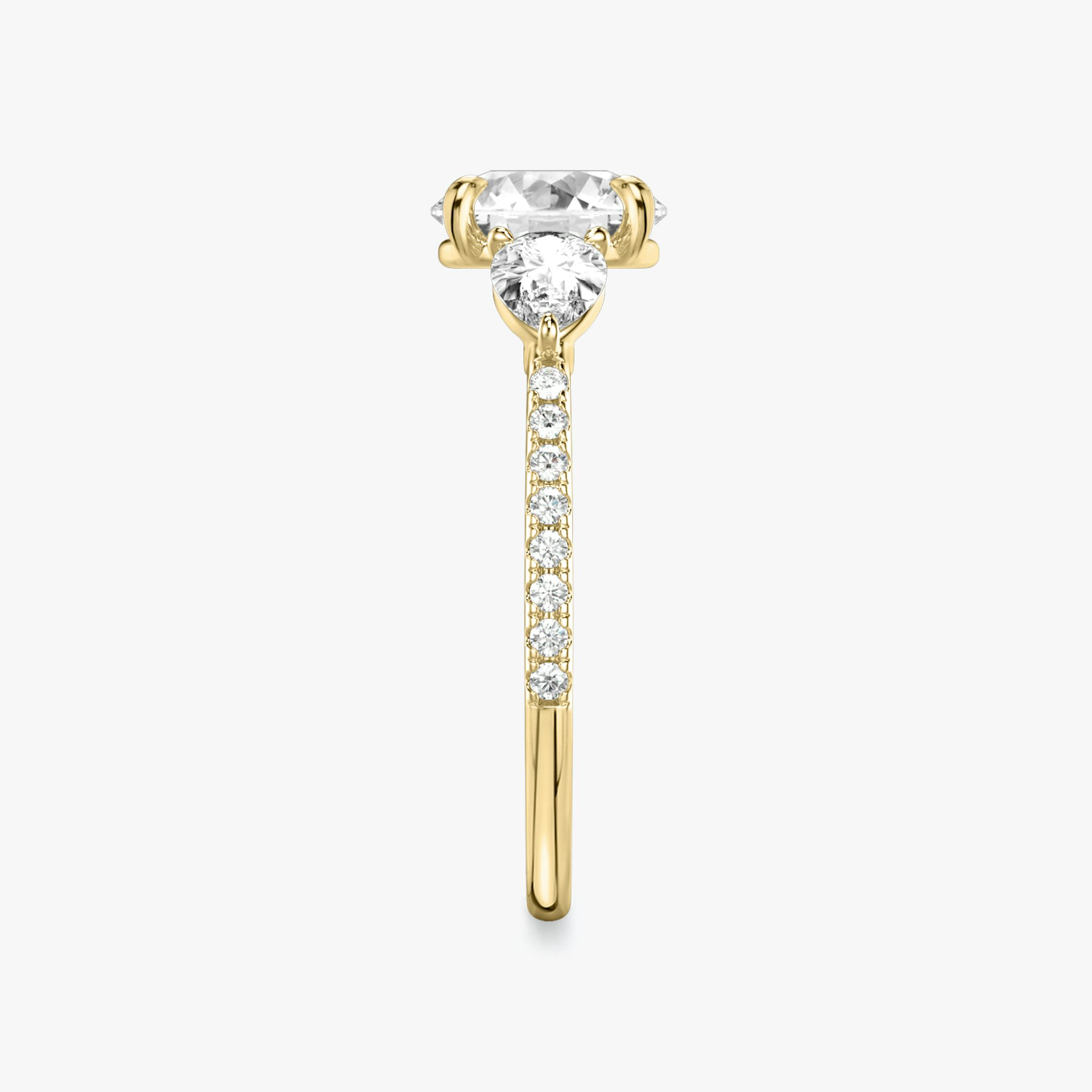 The Three Stone | Round Brilliant | 18k | Yellow Gold | bandAccent: Pavé | caratWeight: other | sideStoneCarat: 0.25ct | sideStoneShape: Pear | diamondOrientation: vertical