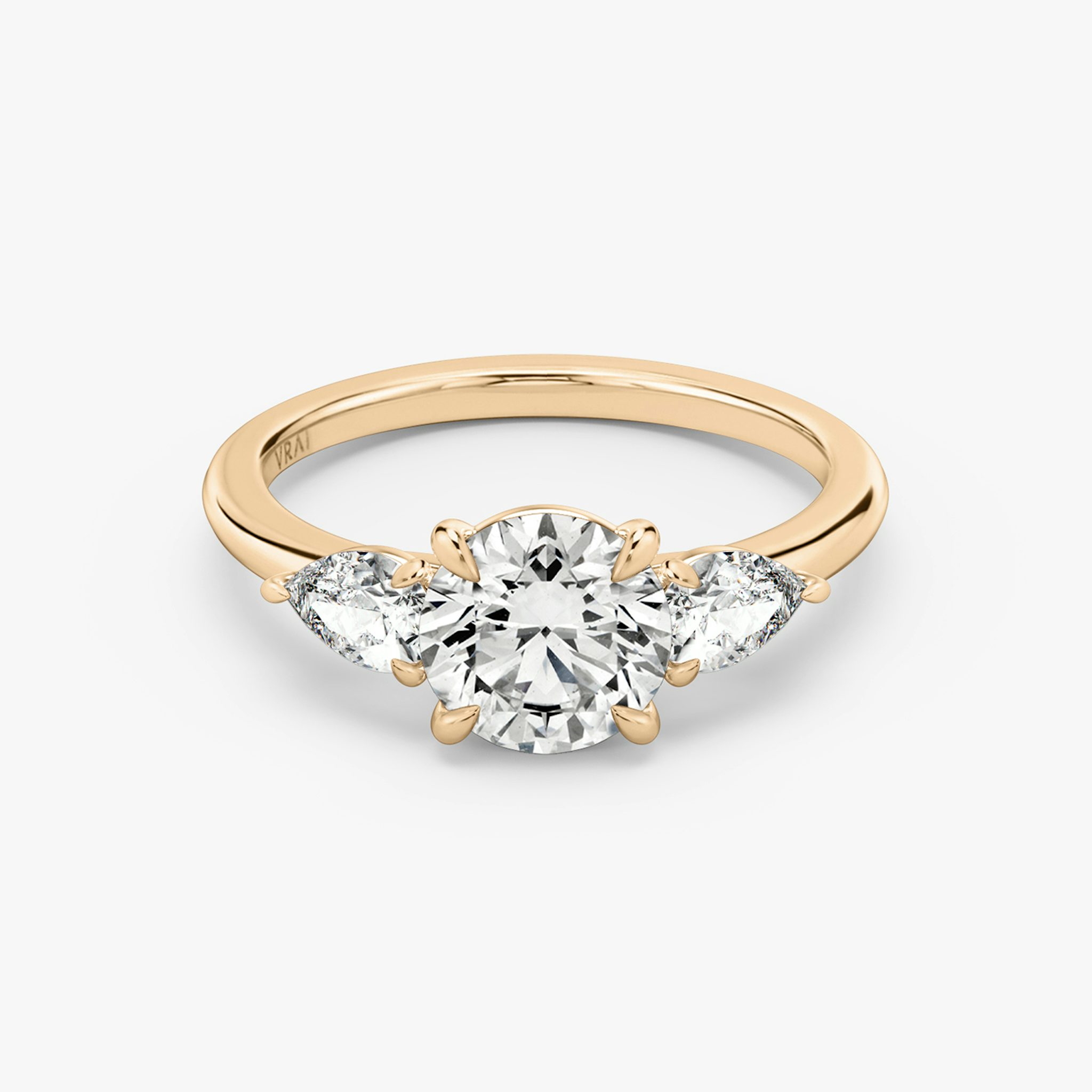 The Three Stone | Round Brilliant | 14k | Rose Gold | bandAccent: Plain | caratWeight: other | sideStoneCarat: 0.25ct | sideStoneShape: Pear | diamondOrientation: vertical