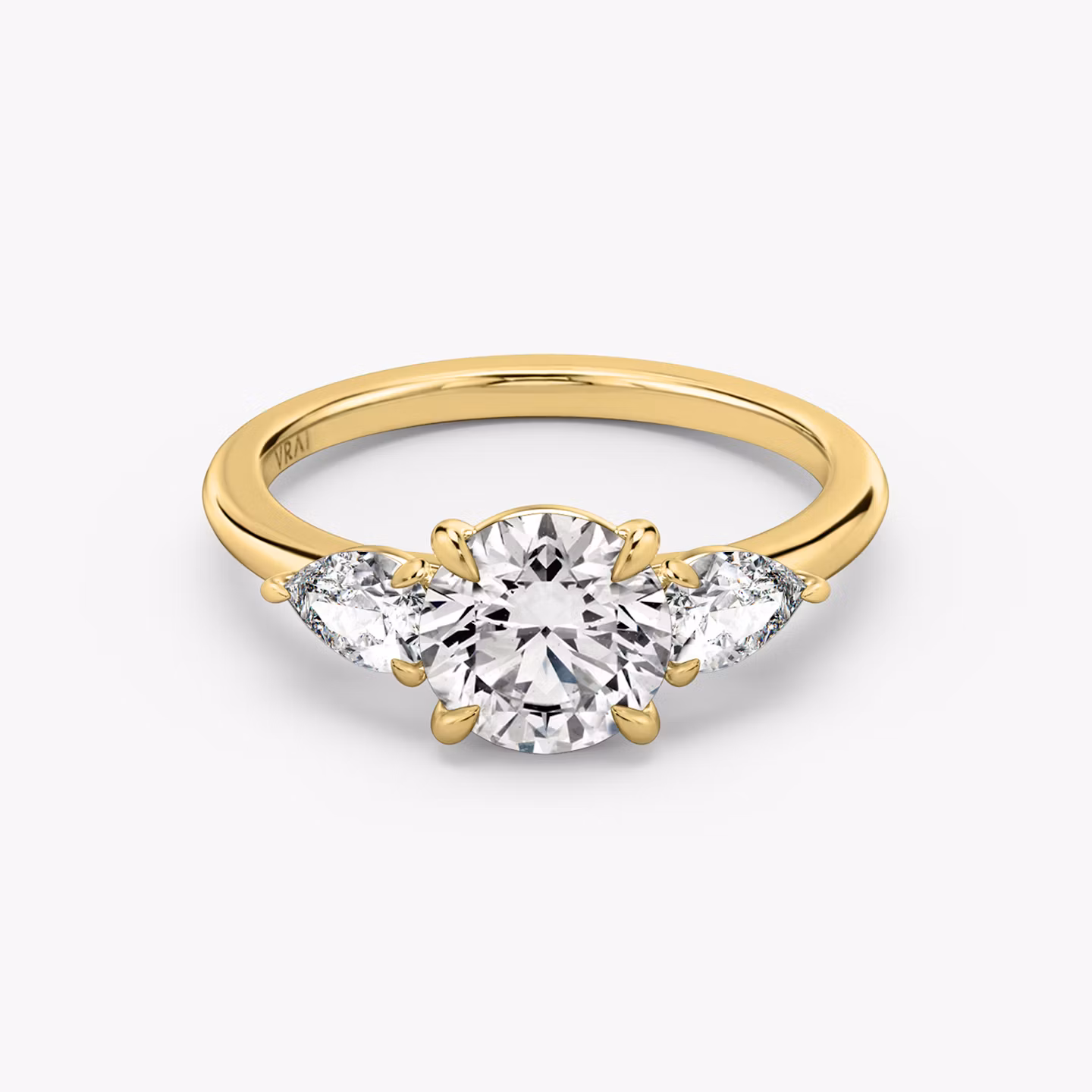 The Three Stone Round Brilliant | Yellow Gold