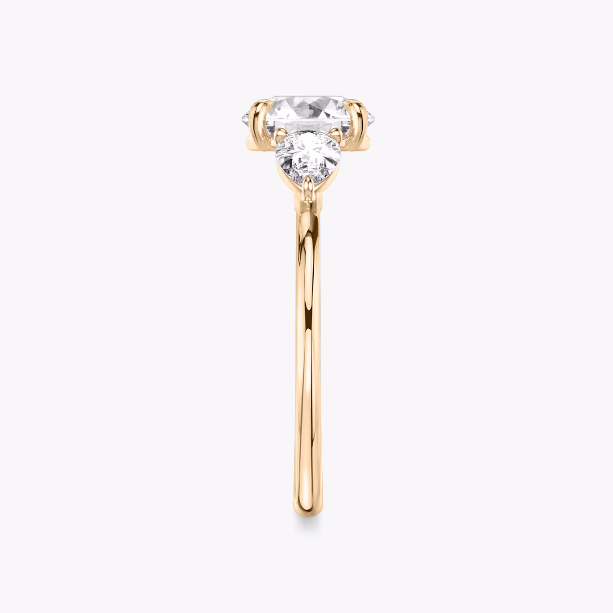 The Three Stone | Round Brilliant | 14k | Rose Gold | bandAccent: Plain | caratWeight: other | sideStoneCarat: 0.25ct | sideStoneShape: Pear | diamondOrientation: vertical