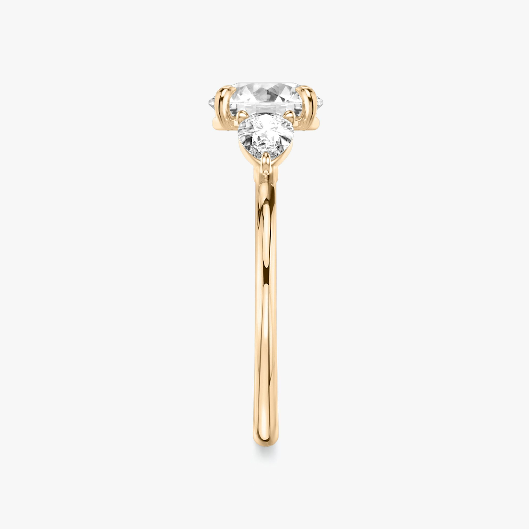 The Three Stone | Round Brilliant | 14k | Rose Gold | bandAccent: Plain | caratWeight: other | sideStoneCarat: 0.25ct | sideStoneShape: Pear | diamondOrientation: vertical