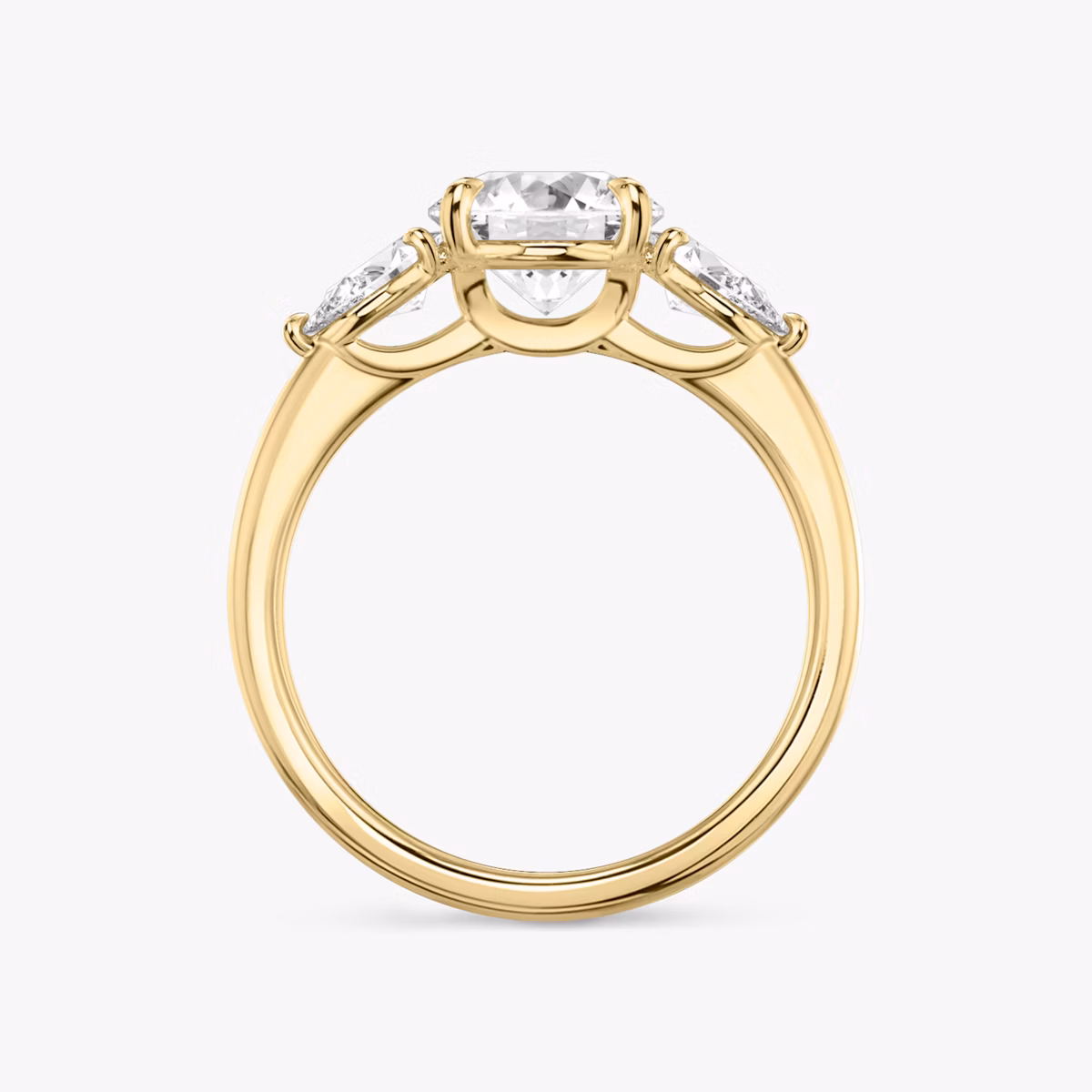 The Three Stone | Round Brilliant | 18k | Yellow Gold | bandAccent: Plain | caratWeight: other | sideStoneCarat: 0.25ct | sideStoneShape: Pear | diamondOrientation: vertical