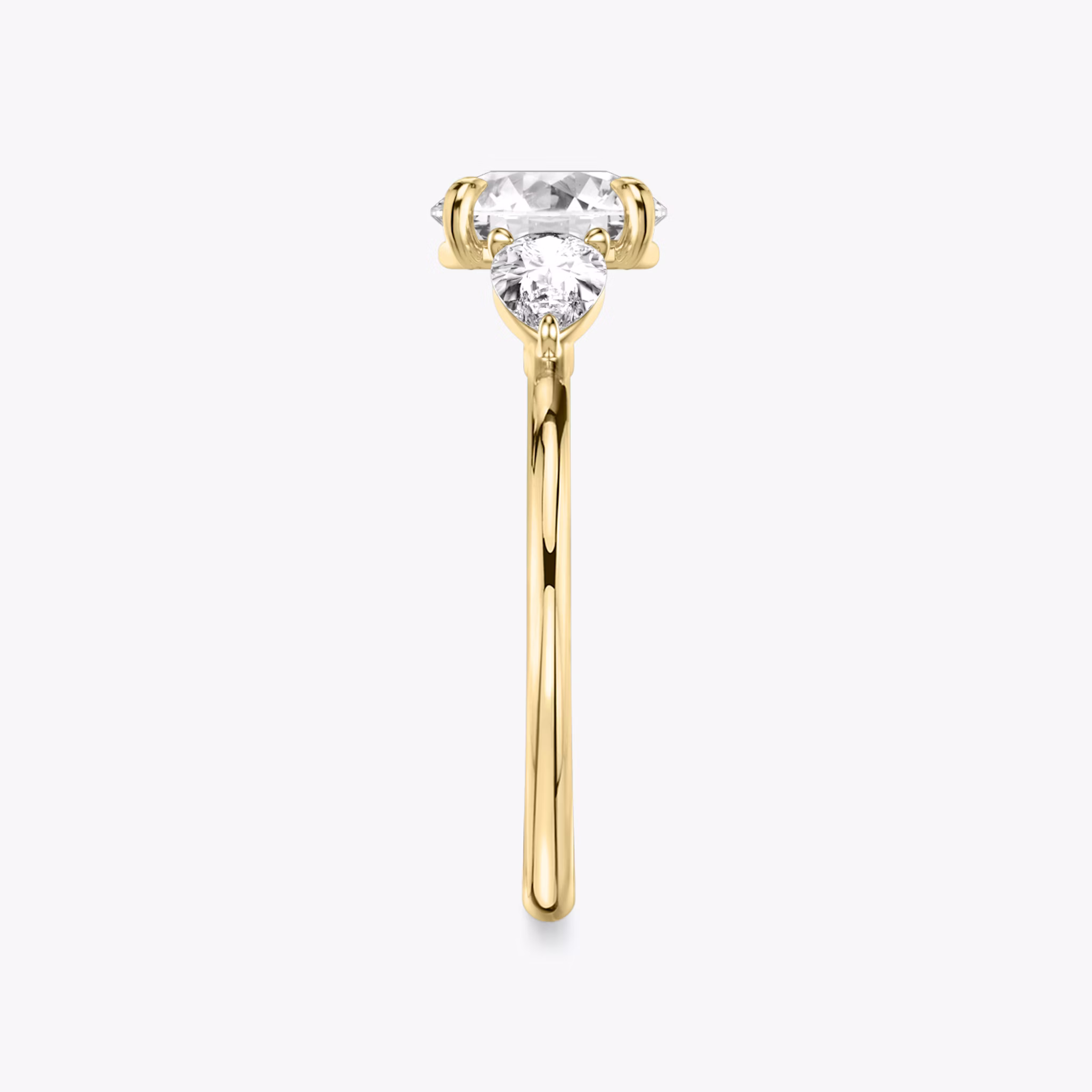 The Three Stone | Round Brilliant | 18k | Yellow Gold | bandAccent: Plain | caratWeight: other | sideStoneCarat: 0.25ct | sideStoneShape: Pear | diamondOrientation: vertical