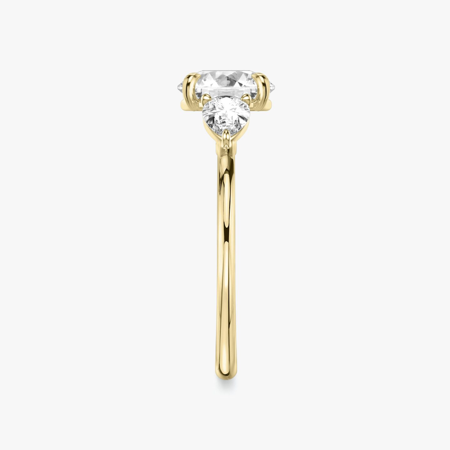 The Three Stone | Round Brilliant | 18k | Yellow Gold | bandAccent: Plain | caratWeight: other | sideStoneCarat: 0.25ct | sideStoneShape: Pear | diamondOrientation: vertical