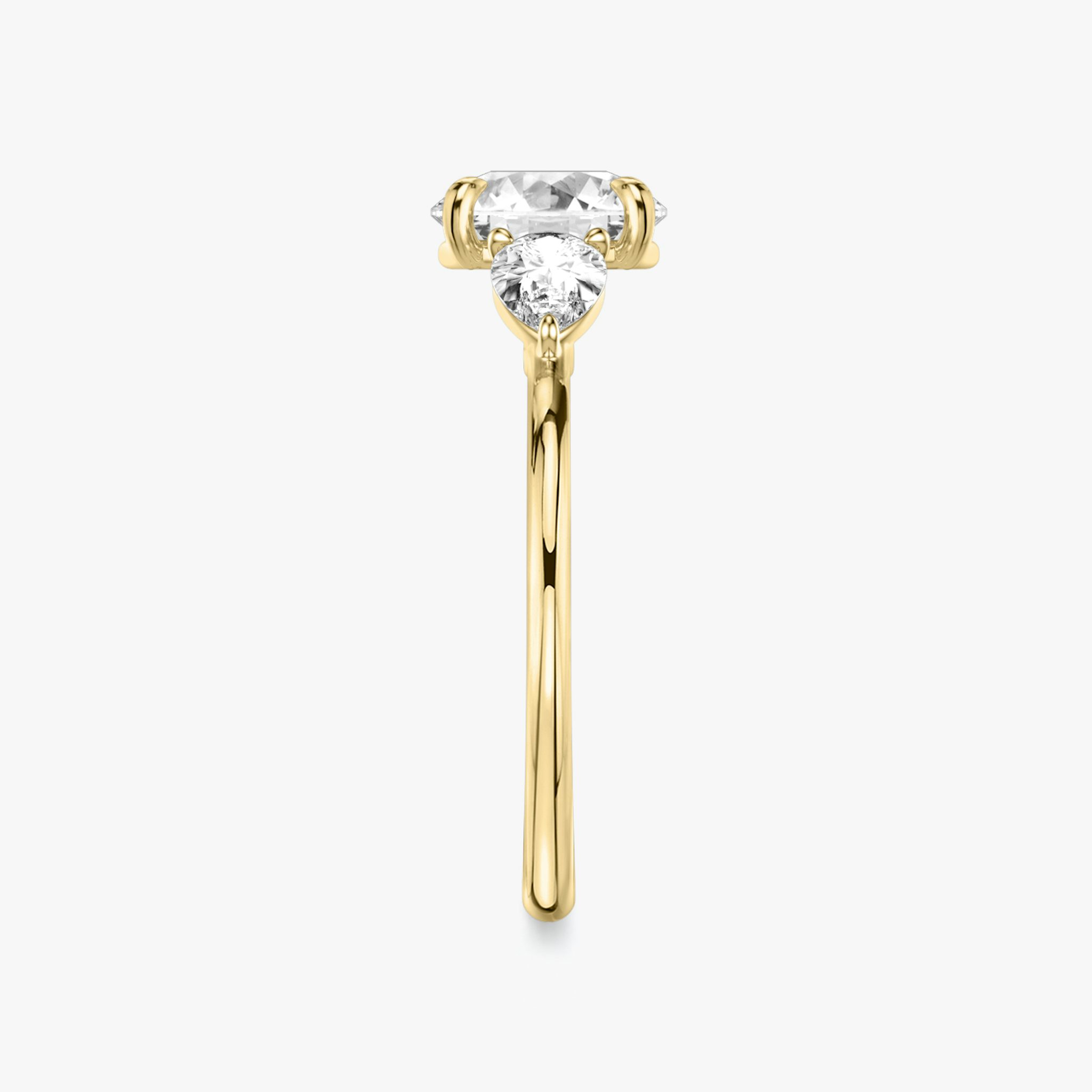 The Three Stone | Round Brilliant | 18k | Yellow Gold | bandAccent: Plain | caratWeight: other | sideStoneCarat: 0.25ct | sideStoneShape: Pear | diamondOrientation: vertical