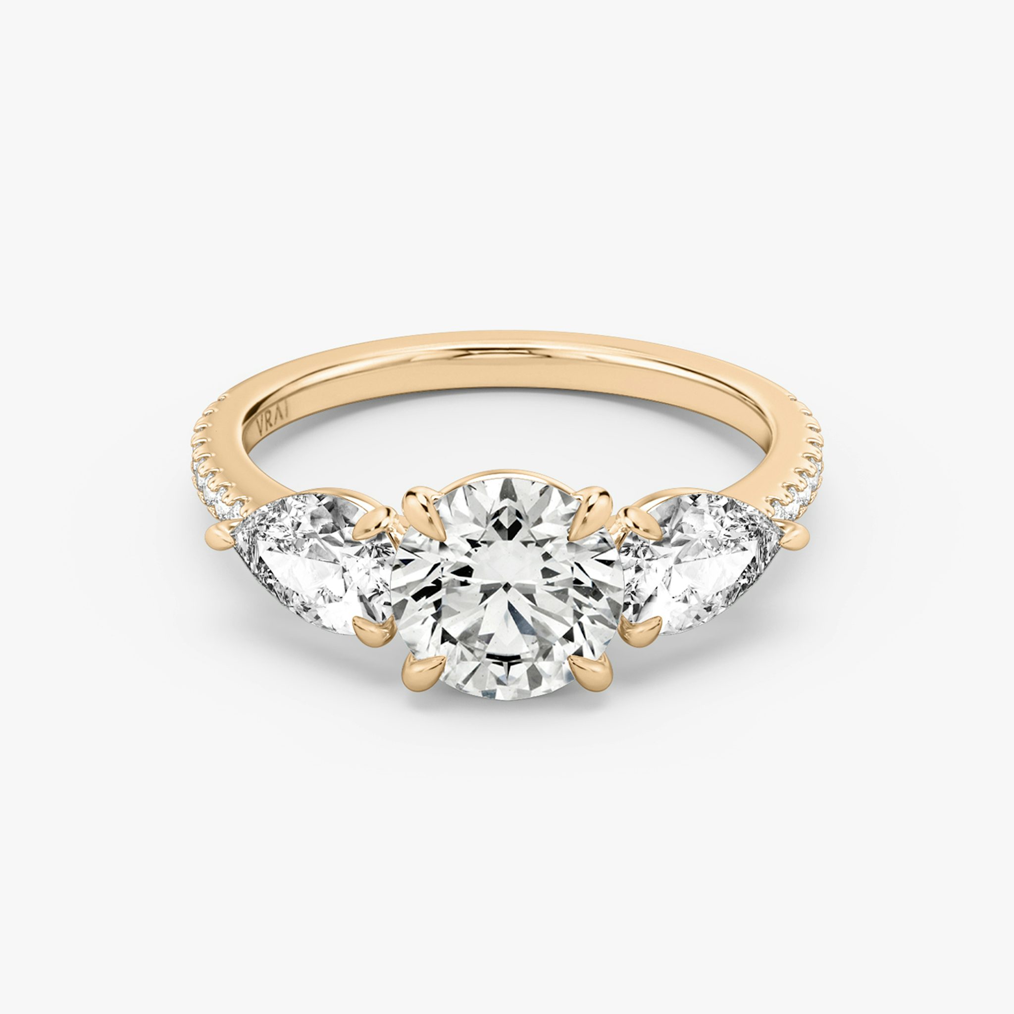The Three Stone | Round Brilliant | 14k | Rose Gold | bandAccent: Pavé | caratWeight: other | sideStoneCarat: 0.50ct | sideStoneShape: Pear | diamondOrientation: vertical
