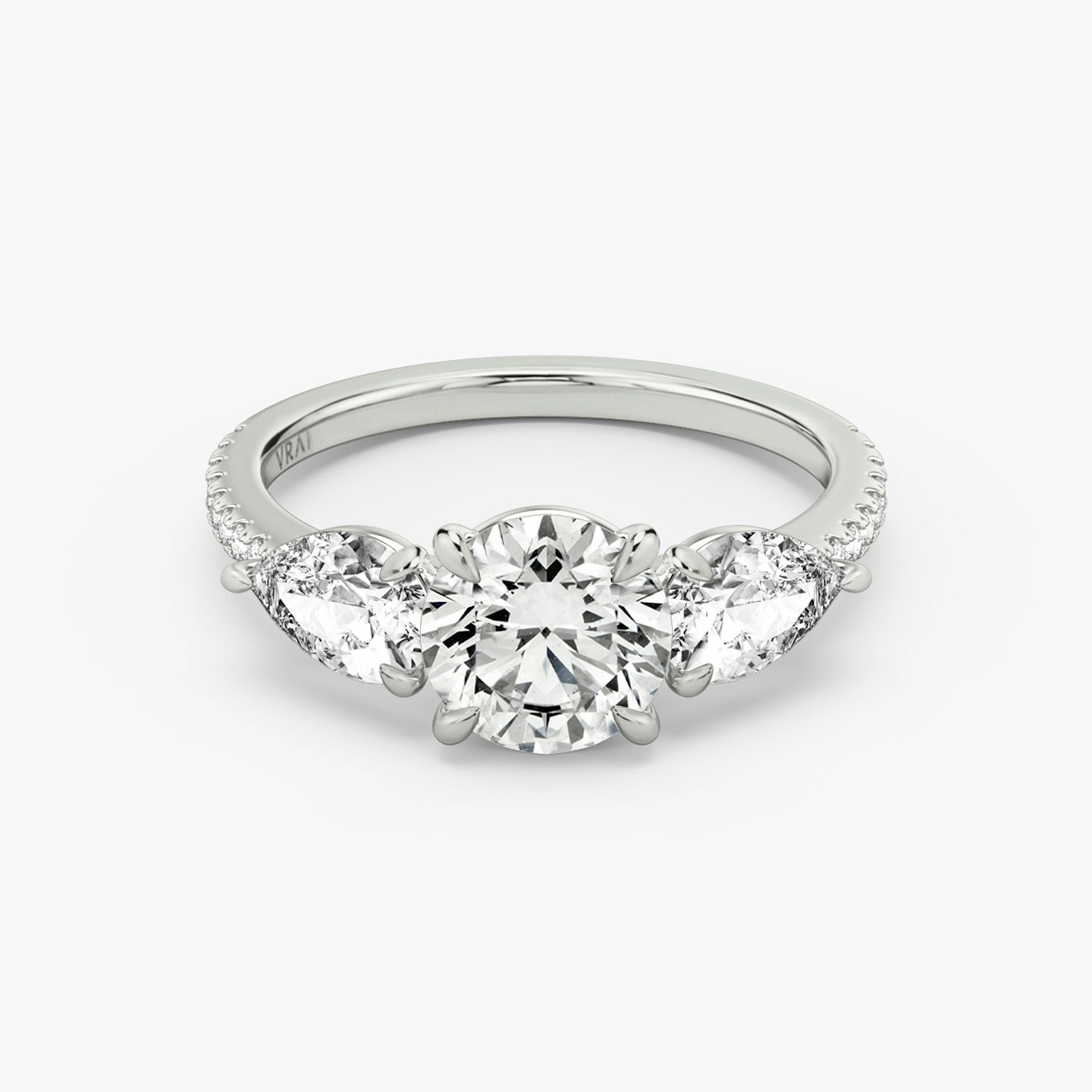 The Three Stone | Round Brilliant | 18k | White Gold | bandAccent: Pavé | caratWeight: other | sideStoneCarat: 0.50ct | sideStoneShape: Pear | diamondOrientation: vertical