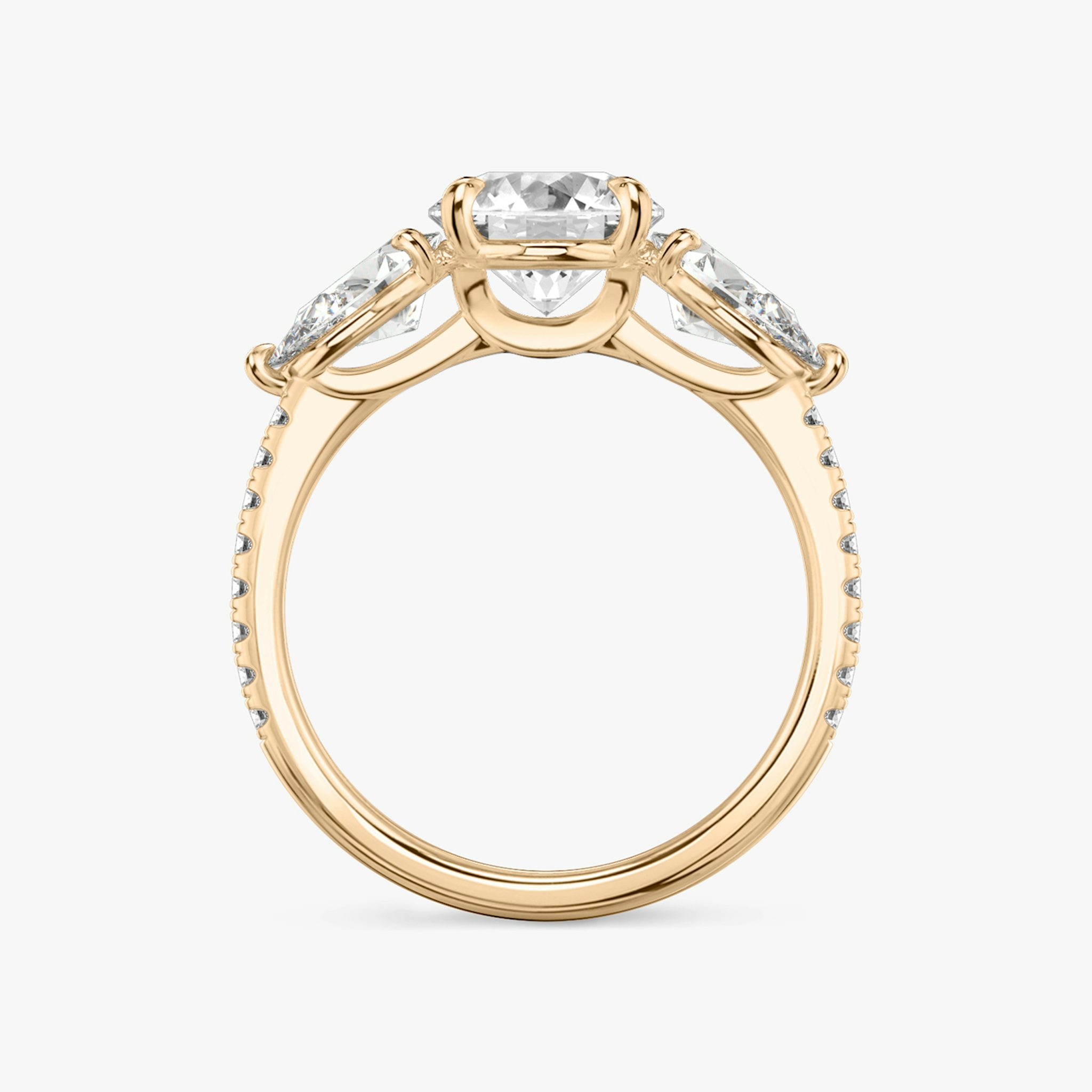 The Three Stone | Round Brilliant | 14k | Rose Gold | bandAccent: Pavé | caratWeight: other | sideStoneCarat: 0.50ct | sideStoneShape: Pear | diamondOrientation: vertical