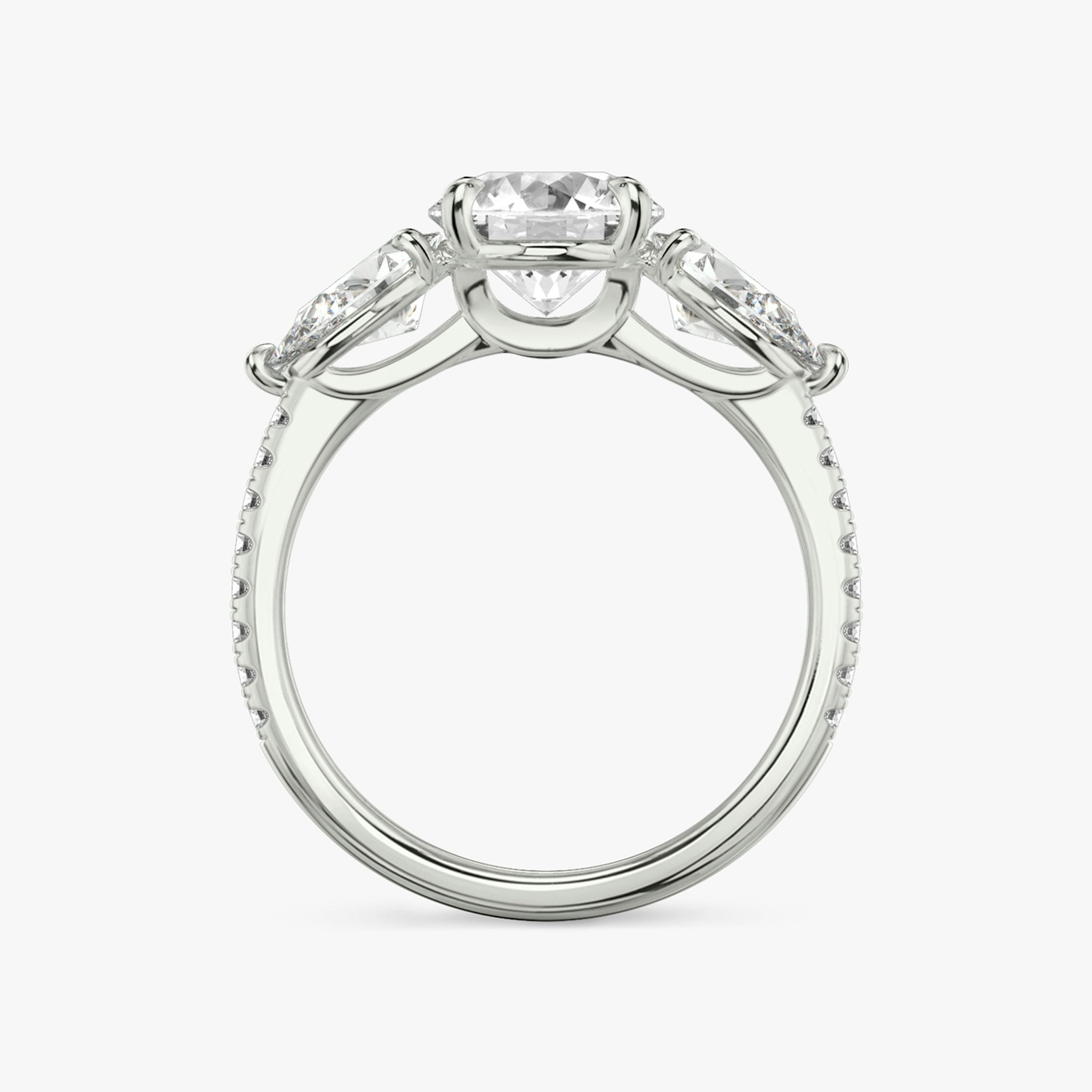 The Three Stone | Round Brilliant | Platinum | bandAccent: Pavé | caratWeight: other | sideStoneCarat: 0.50ct | sideStoneShape: Pear | diamondOrientation: vertical