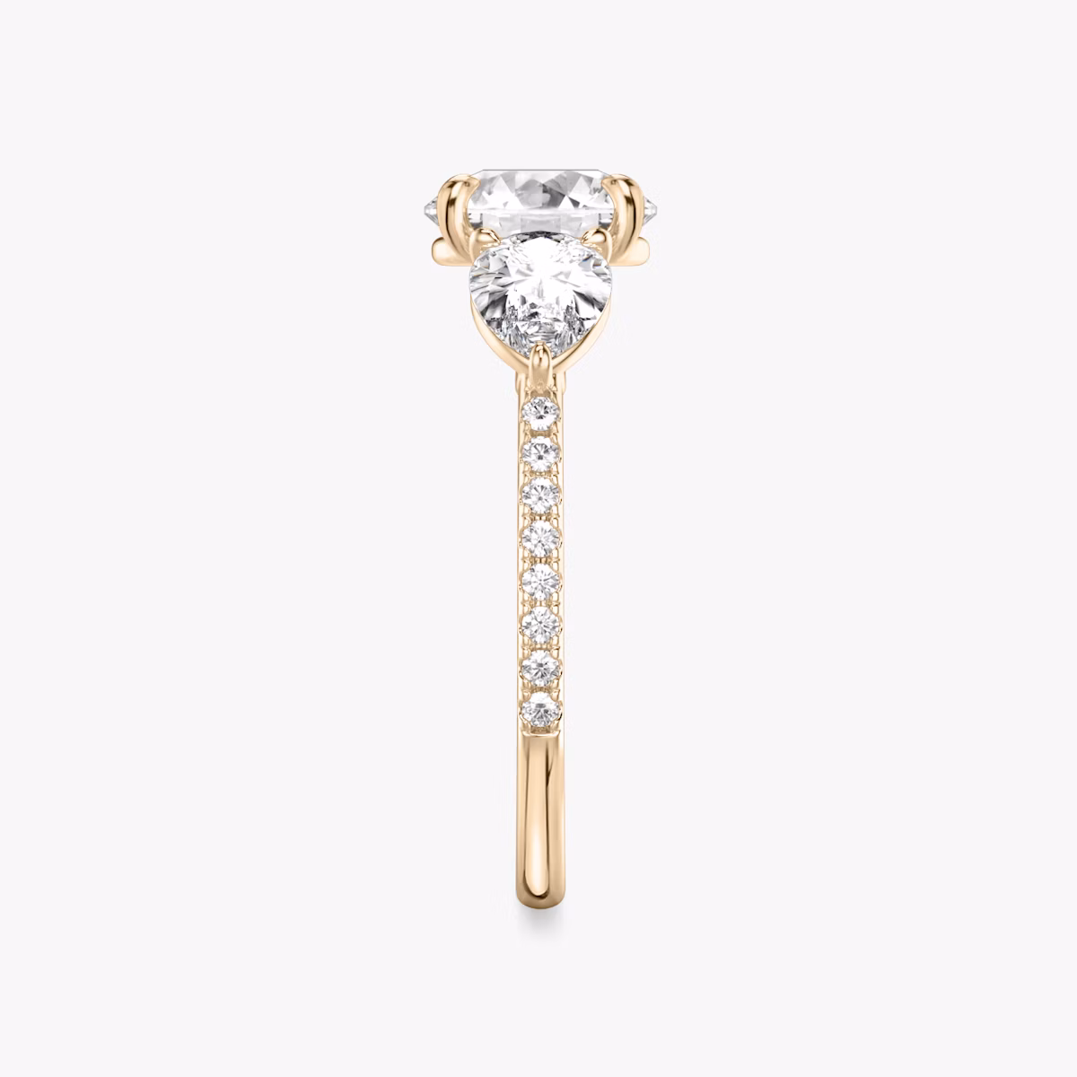 The Three Stone | Round Brilliant | 14k | Rose Gold | bandAccent: Pavé | caratWeight: other | sideStoneCarat: 0.50ct | sideStoneShape: Pear | diamondOrientation: vertical