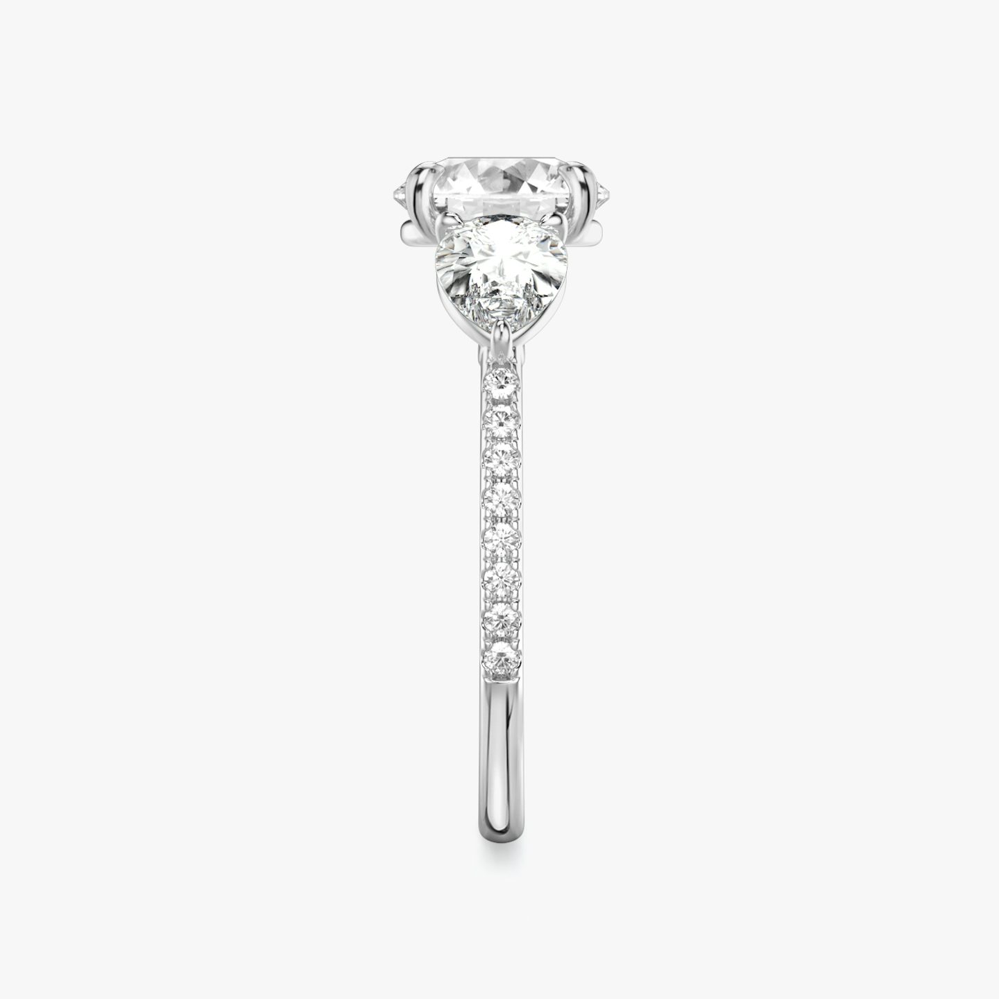 The Three Stone | Round Brilliant | 18k | White Gold | bandAccent: Pavé | caratWeight: other | sideStoneCarat: 0.50ct | sideStoneShape: Pear | diamondOrientation: vertical