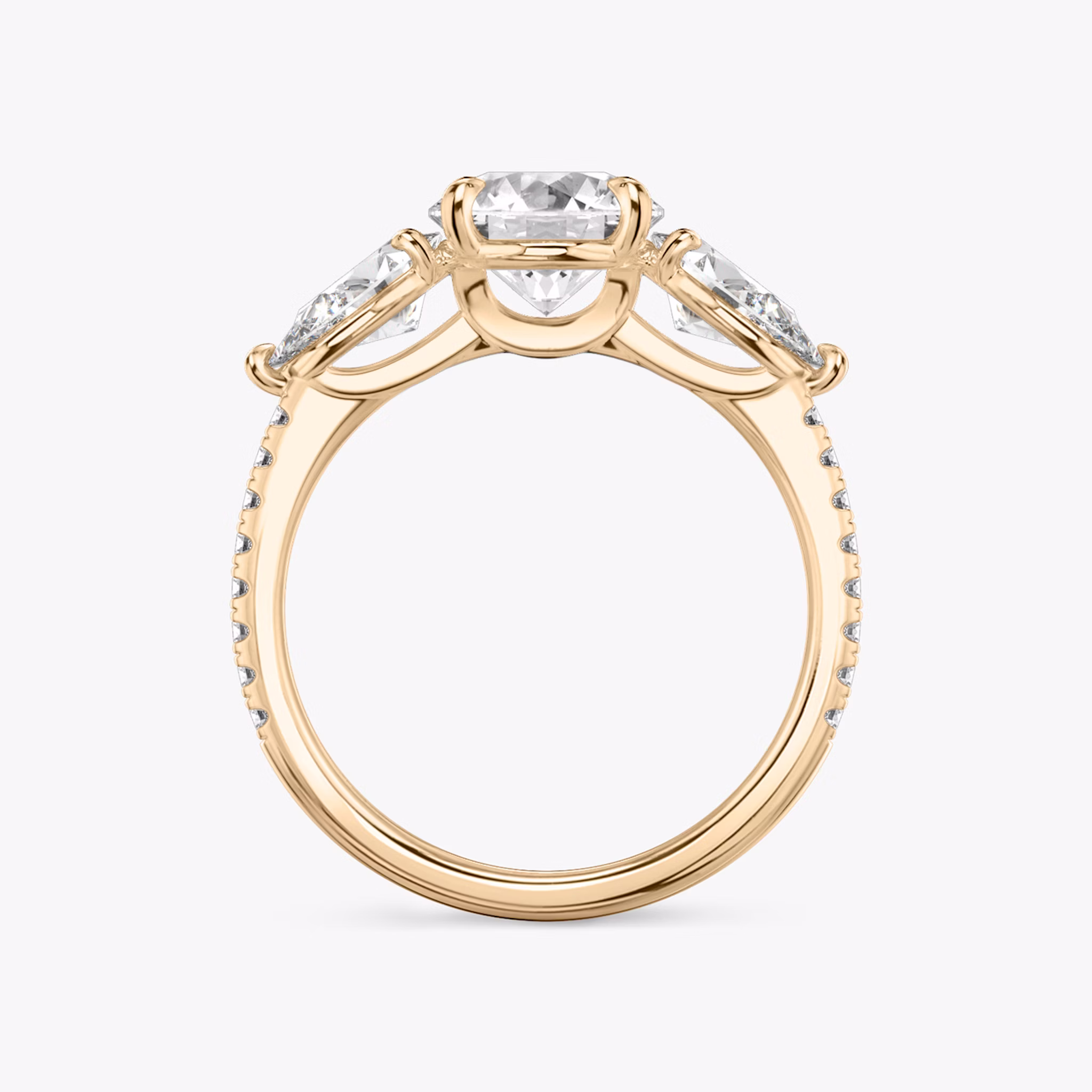 The Three Stone | Round Brilliant | 18k | Yellow Gold | bandAccent: Pavé | caratWeight: other | sideStoneCarat: 0.50ct | sideStoneShape: Pear | diamondOrientation: vertical