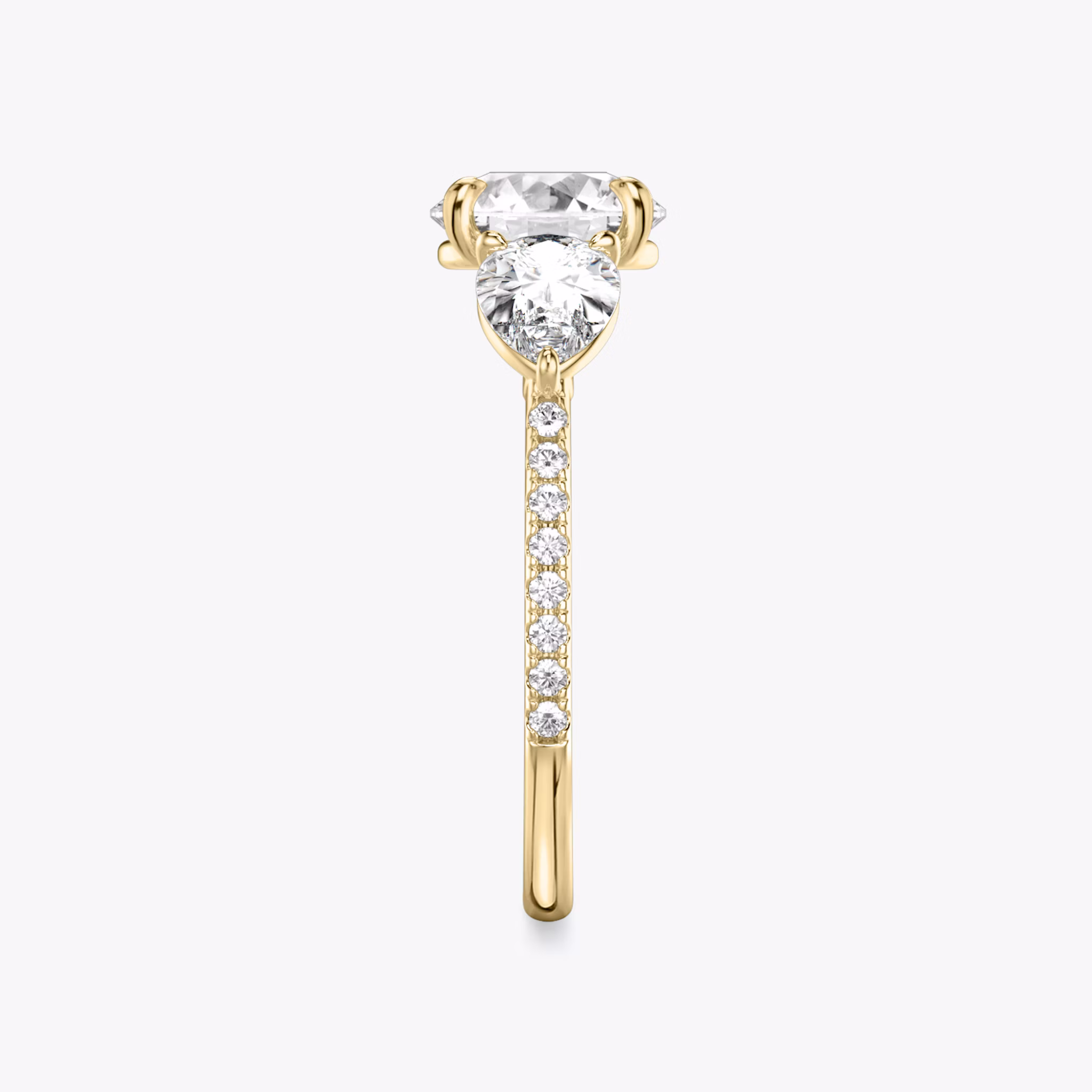 The Three Stone | Round Brilliant | 18k | Yellow Gold | bandAccent: Pavé | caratWeight: other | sideStoneCarat: 0.50ct | sideStoneShape: Pear | diamondOrientation: vertical