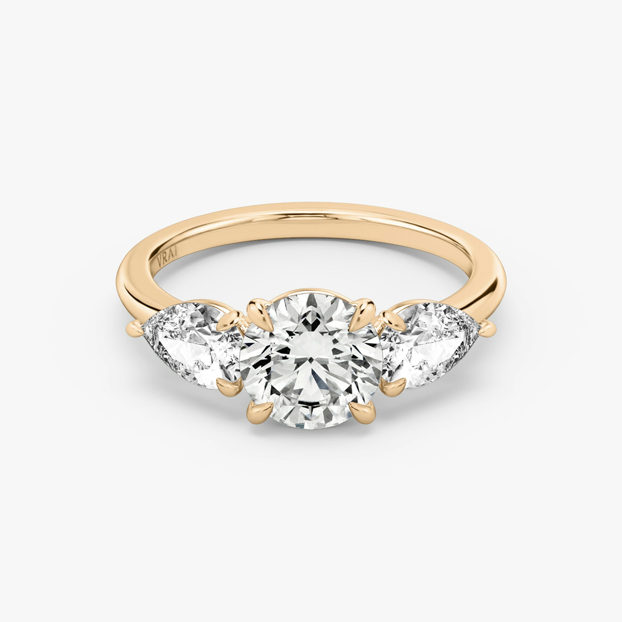 The Three Stone | Round Brilliant | 14k | Rose Gold | bandAccent: Plain | caratWeight: other | sideStoneCarat: 0.50ct | sideStoneShape: Pear | diamondOrientation: vertical