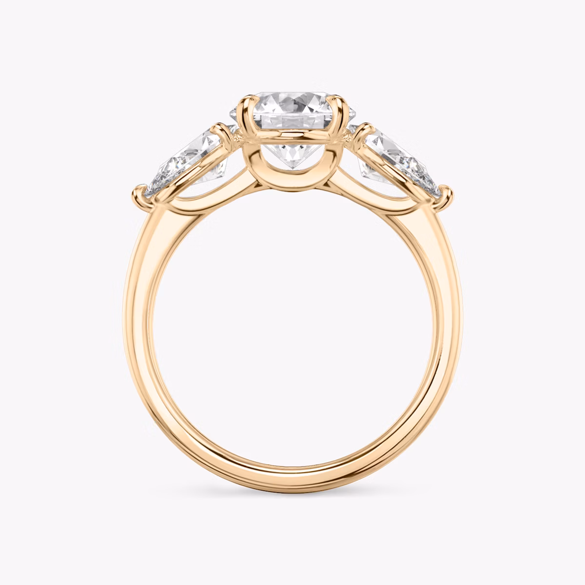 The Three Stone | Round Brilliant | 14k | Rose Gold | bandAccent: Plain | caratWeight: other | sideStoneCarat: 0.50ct | sideStoneShape: Pear | diamondOrientation: vertical