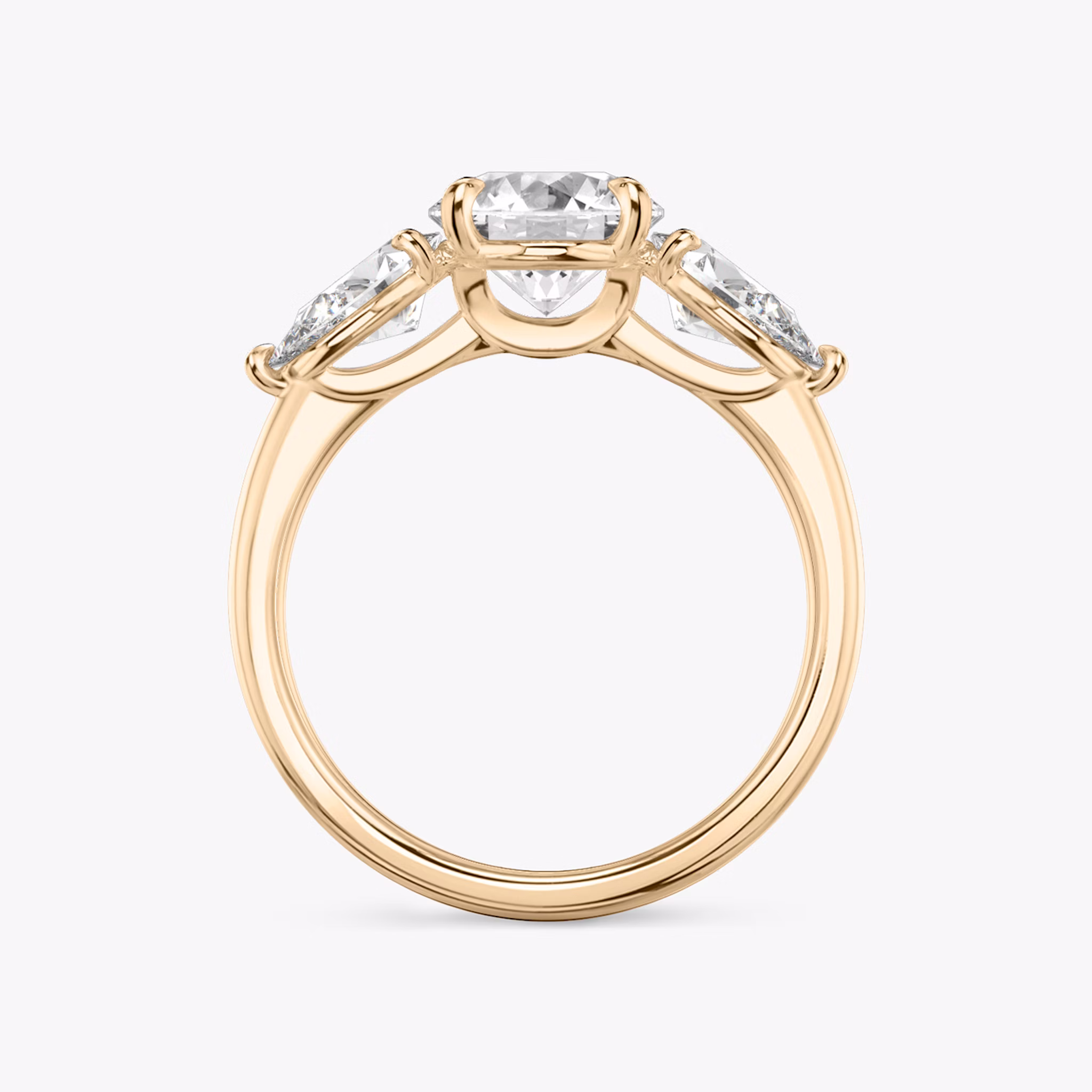 The Three Stone | Round Brilliant | 14k | Rose Gold | bandAccent: Plain | caratWeight: other | sideStoneCarat: 0.50ct | sideStoneShape: Pear | diamondOrientation: vertical