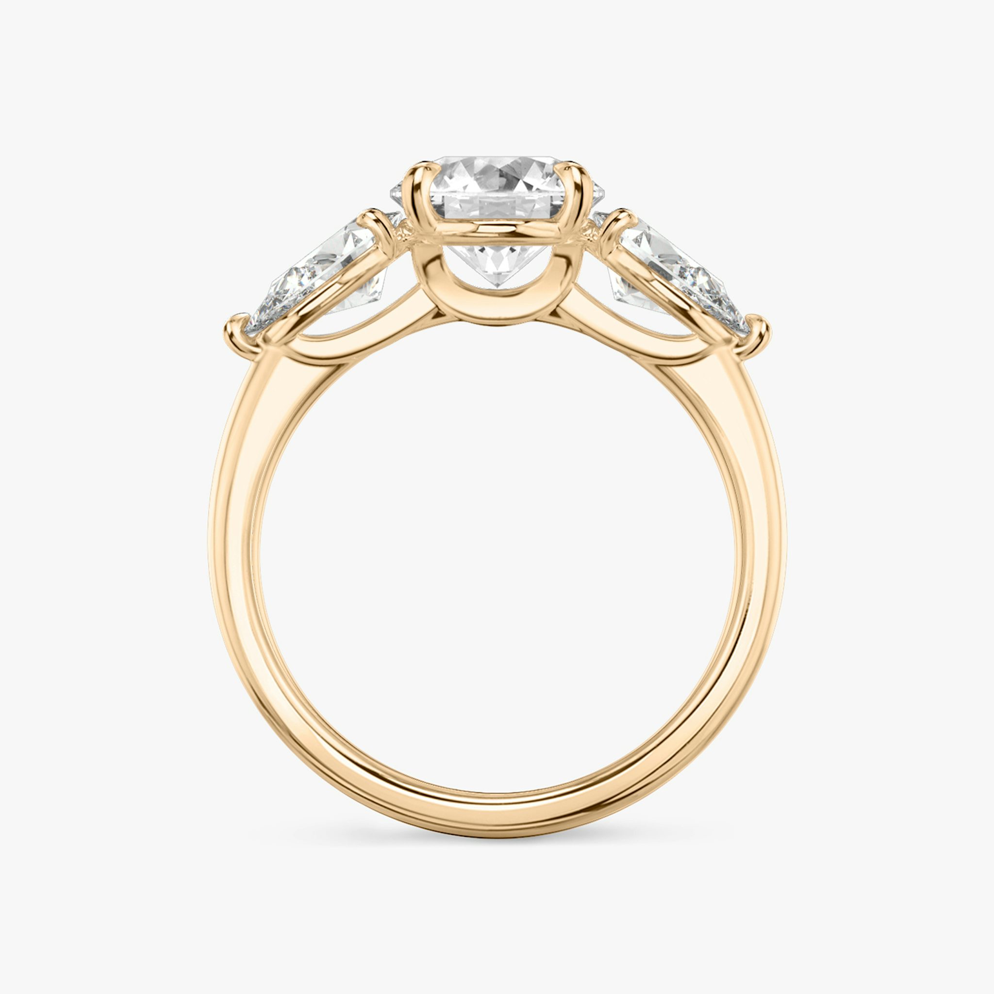The Three Stone | Round Brilliant | 14k | Rose Gold | bandAccent: Plain | caratWeight: other | sideStoneCarat: 0.50ct | sideStoneShape: Pear | diamondOrientation: vertical