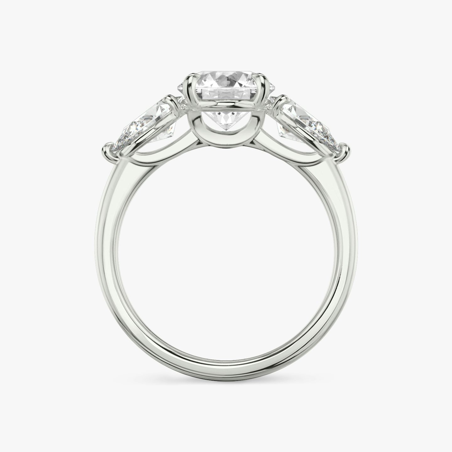The Three Stone | Round Brilliant | 18k | White Gold | bandAccent: Plain | caratWeight: other | sideStoneCarat: 0.50ct | sideStoneShape: Pear | diamondOrientation: vertical
