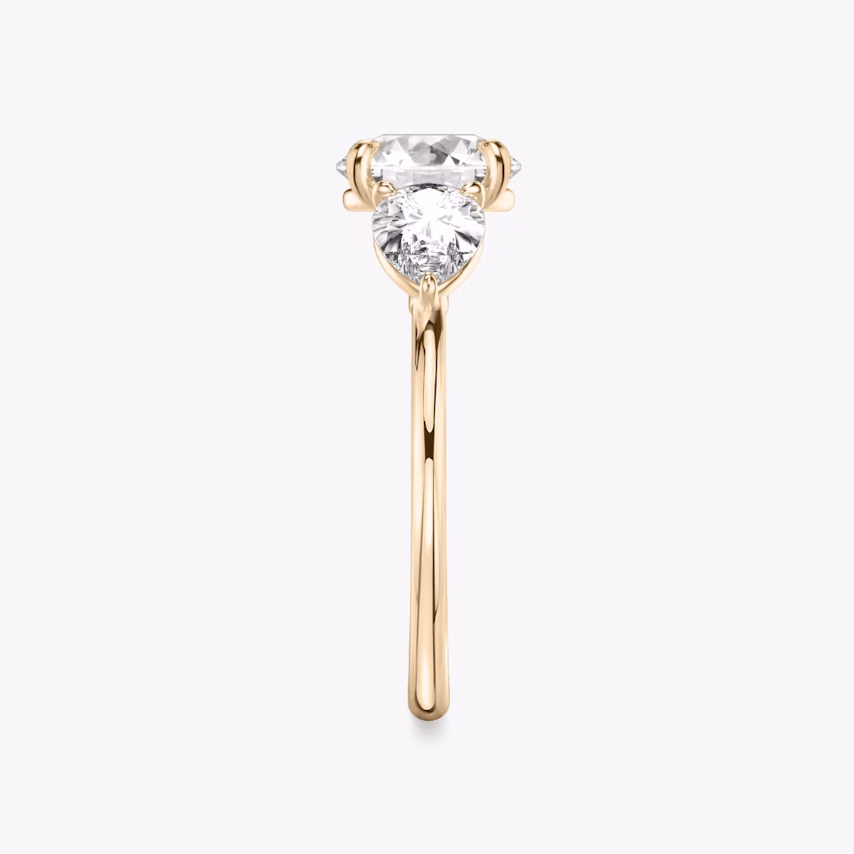 The Three Stone | Round Brilliant | 14k | Rose Gold | bandAccent: Plain | caratWeight: other | sideStoneCarat: 0.50ct | sideStoneShape: Pear | diamondOrientation: vertical