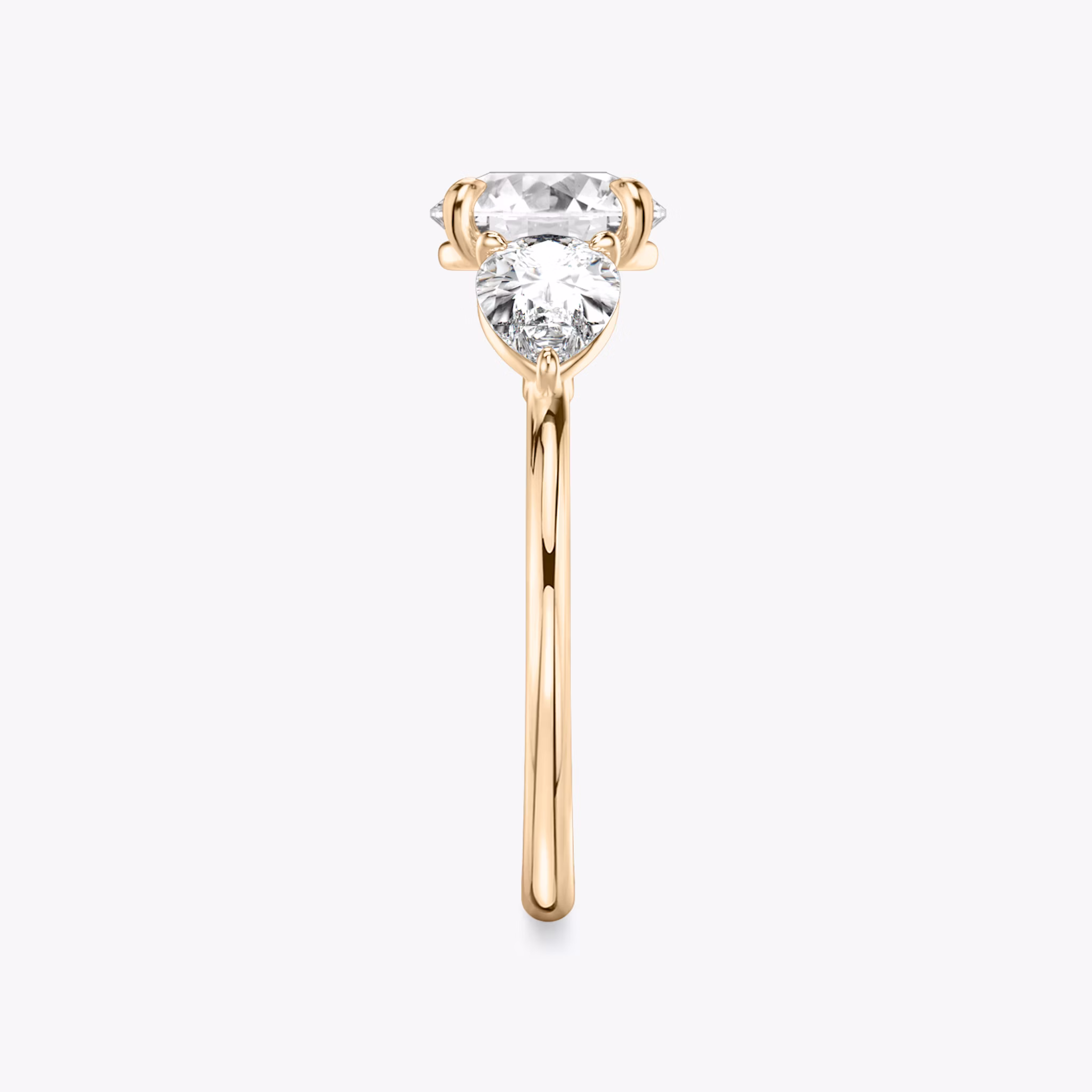 The Three Stone | Round Brilliant | 14k | Rose Gold | bandAccent: Plain | caratWeight: other | sideStoneCarat: 0.50ct | sideStoneShape: Pear | diamondOrientation: vertical