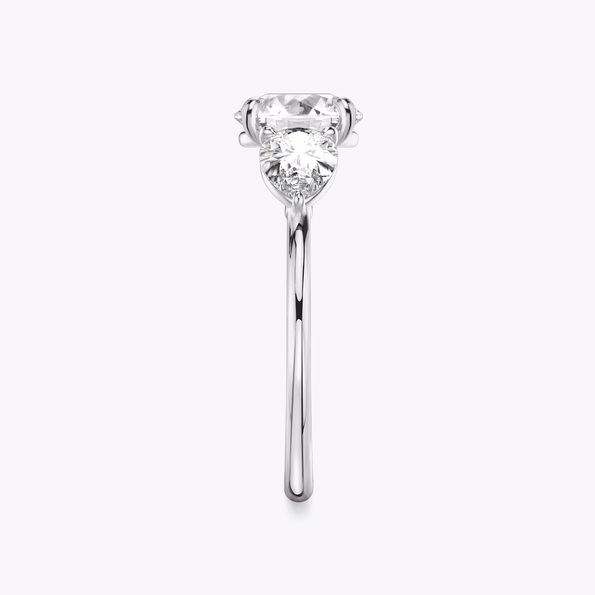 The Three Stone | Round Brilliant | 18k | White Gold | bandAccent: Plain | caratWeight: other | sideStoneCarat: 0.50ct | sideStoneShape: Pear | diamondOrientation: vertical