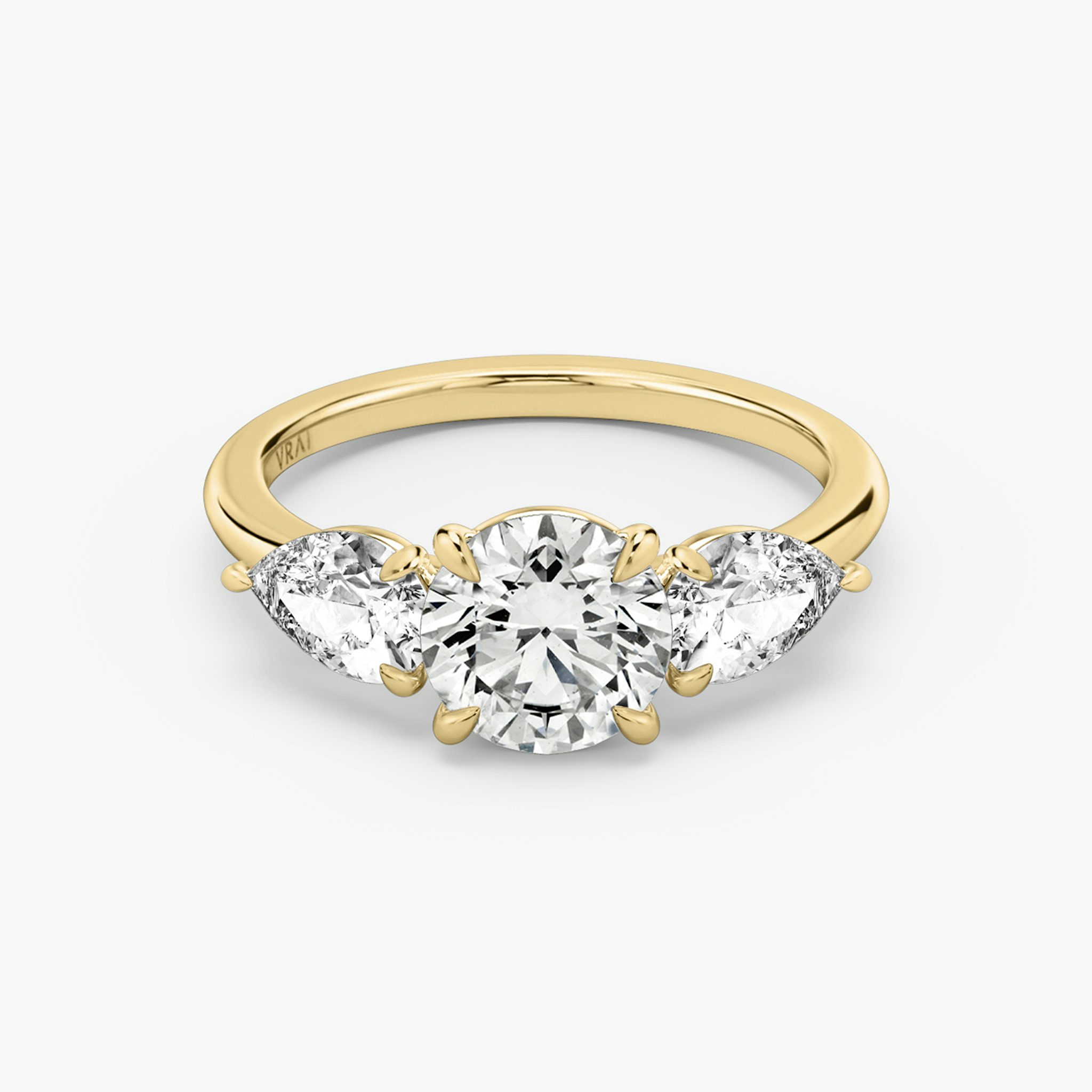 The Three Stone | Round Brilliant | 18k | Yellow Gold | bandAccent: Plain | caratWeight: other | sideStoneCarat: 0.50ct | sideStoneShape: Pear | diamondOrientation: vertical