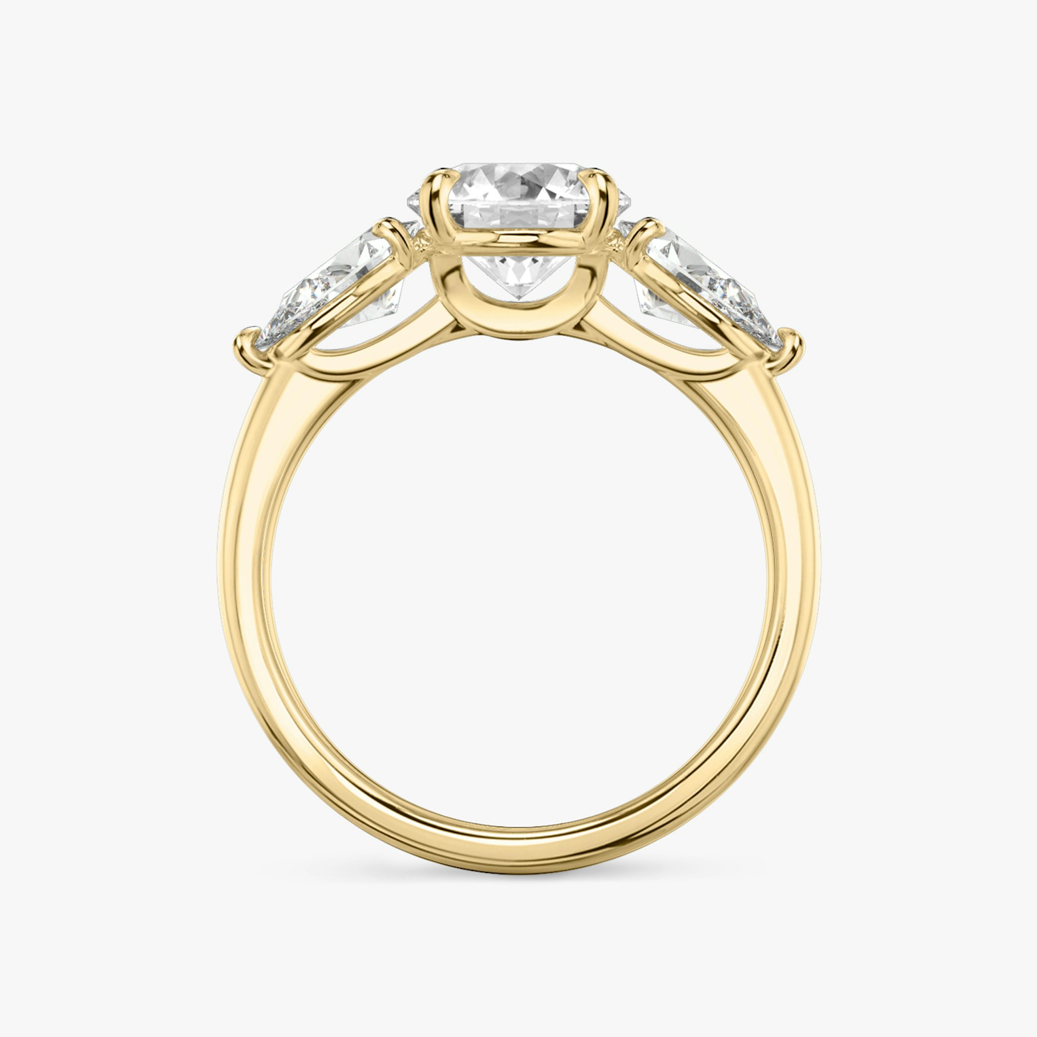 The Three Stone | Round Brilliant | 18k | Yellow Gold | bandAccent: Plain | caratWeight: other | sideStoneCarat: 0.50ct | sideStoneShape: Pear | diamondOrientation: vertical