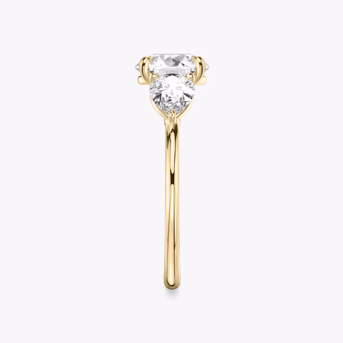 The Three Stone | Round Brilliant | 18k | Yellow Gold | bandAccent: Plain | caratWeight: other | sideStoneCarat: 0.50ct | sideStoneShape: Pear | diamondOrientation: vertical
