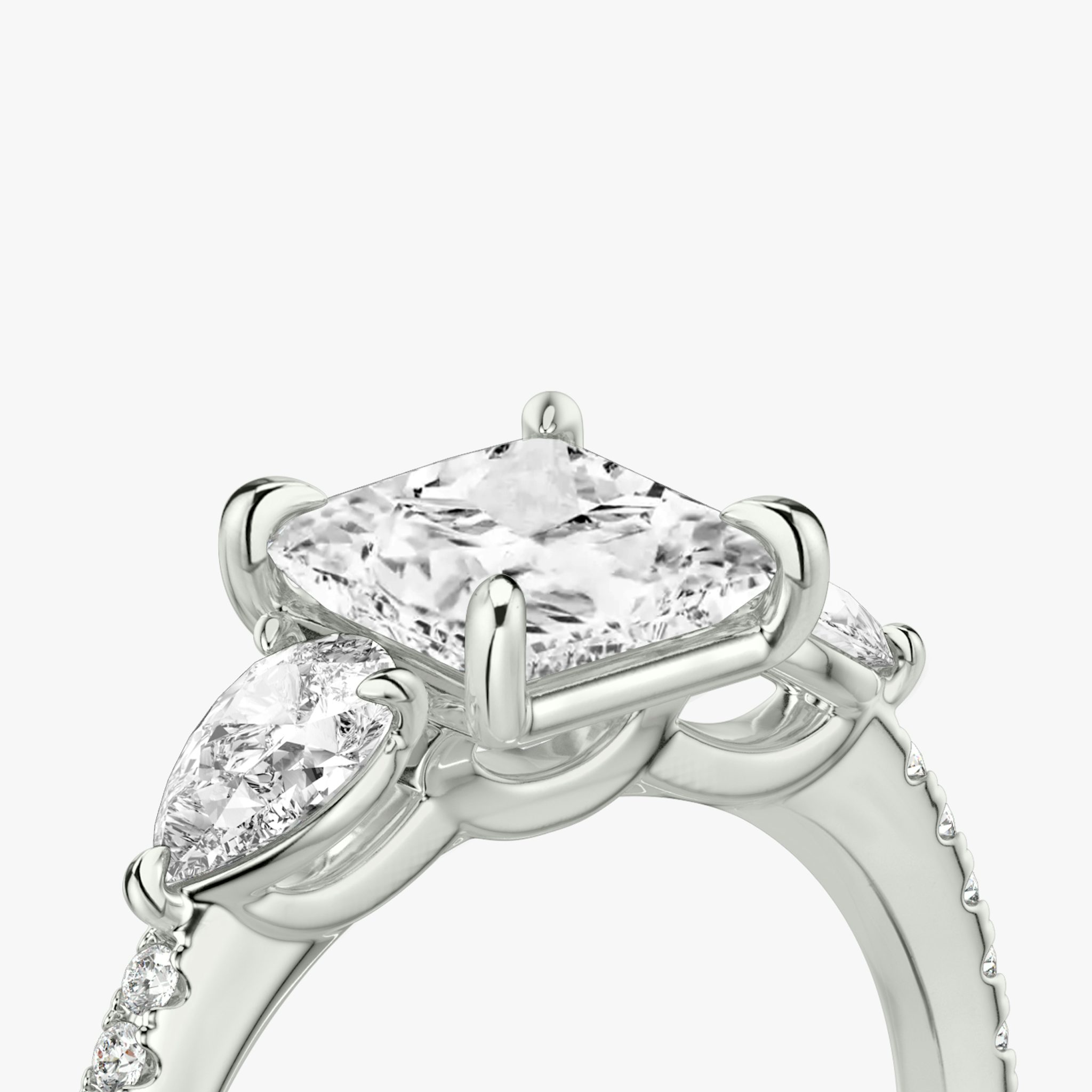 The Three Stone | Princess | 18k | White Gold | bandAccent: Pavé | sideStoneCarat: 0.25ct | sideStoneShape: Pear | diamondOrientation: vertical | caratWeight: other