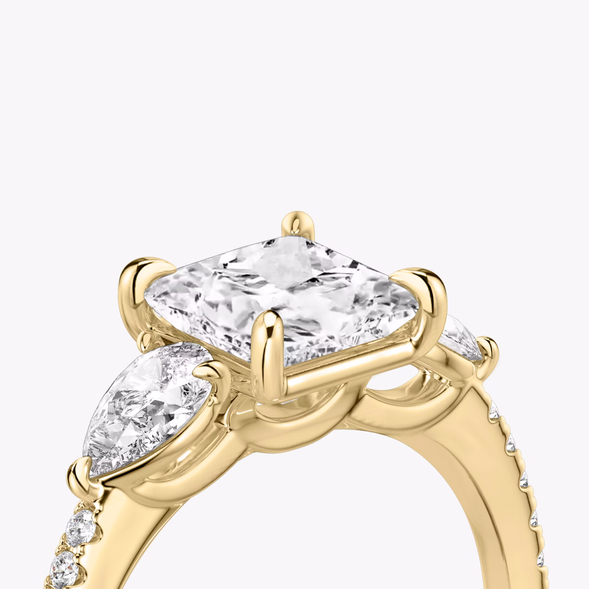 The Three Stone | Princess | 18k | Yellow Gold | bandAccent: Pavé | sideStoneCarat: 0.25ct | sideStoneShape: Pear | diamondOrientation: vertical | caratWeight: other