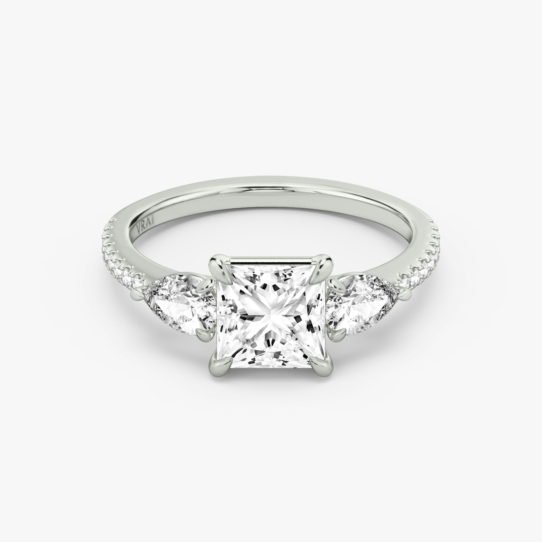 The Three Stone | Princess | 18k | White Gold | bandAccent: Pavé | sideStoneCarat: 0.25ct | sideStoneShape: Pear | diamondOrientation: vertical | caratWeight: other