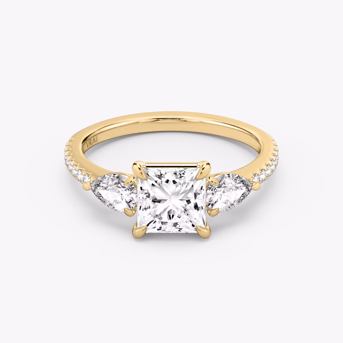 The Three Stone | Princess | 18k | Yellow Gold | bandAccent: Pavé | sideStoneCarat: 0.25ct | sideStoneShape: Pear | diamondOrientation: vertical | caratWeight: other