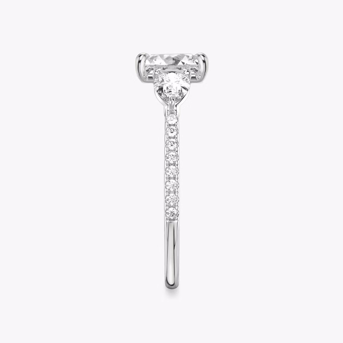 The Three Stone | Princess | Platinum | bandAccent: Pavé | sideStoneCarat: 0.25ct | sideStoneShape: Pear | diamondOrientation: vertical | caratWeight: other