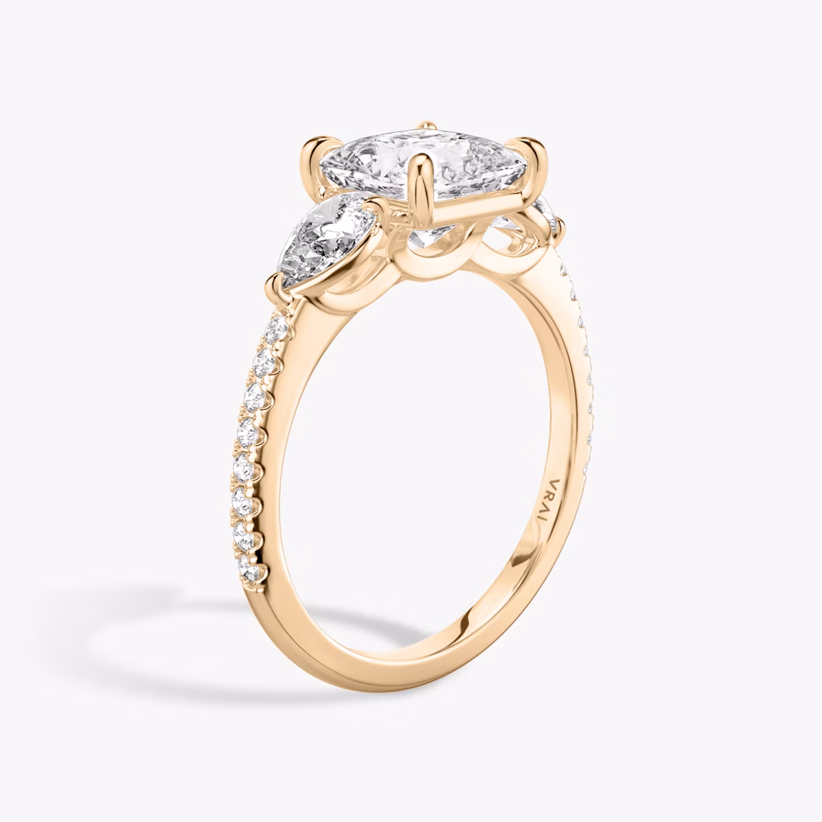 The Three Stone | Princess | 14k | Rose Gold | bandAccent: Pavé | sideStoneCarat: 0.25ct | sideStoneShape: Pear | diamondOrientation: vertical | caratWeight: other