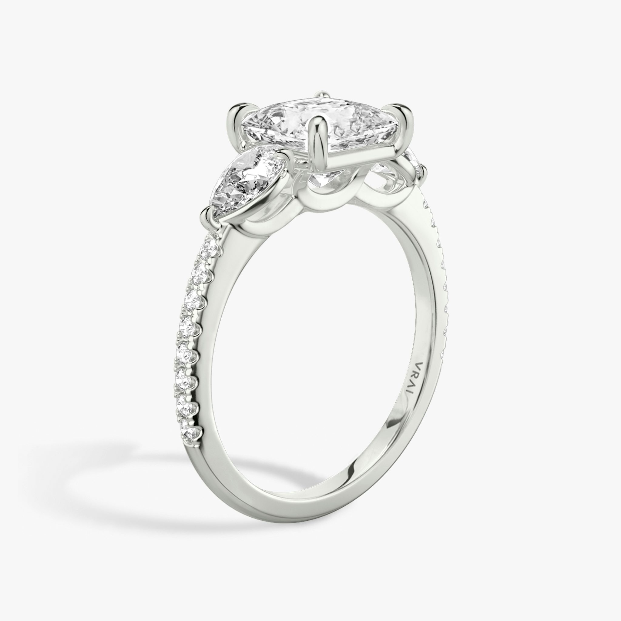 The Three Stone | Princess | 18k | White Gold | bandAccent: Pavé | sideStoneCarat: 0.25ct | sideStoneShape: Pear | diamondOrientation: vertical | caratWeight: other