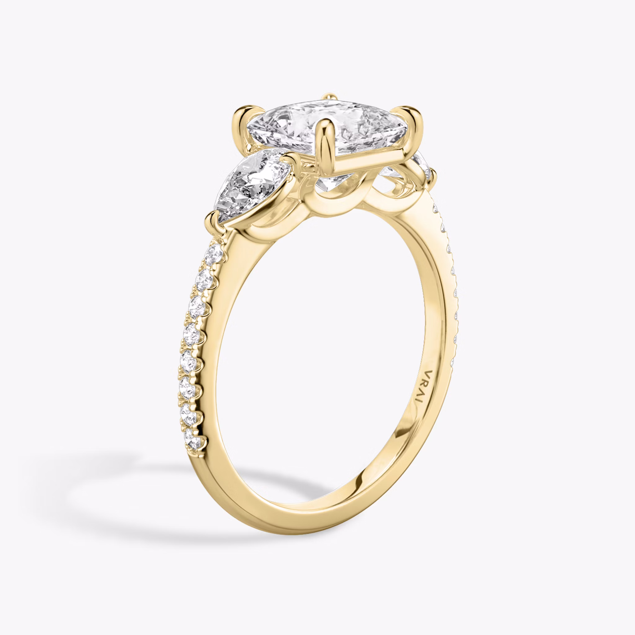 The Three Stone | Princess | 18k | Yellow Gold | bandAccent: Pavé | sideStoneCarat: 0.25ct | sideStoneShape: Pear | diamondOrientation: vertical | caratWeight: other
