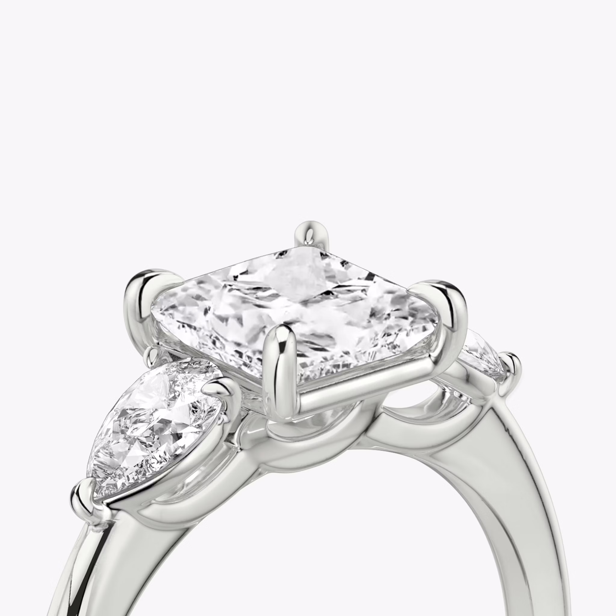 The Three Stone | Princess | 18k | White Gold | bandAccent: Plain | sideStoneCarat: 0.25ct | sideStoneShape: Pear | diamondOrientation: vertical | caratWeight: other
